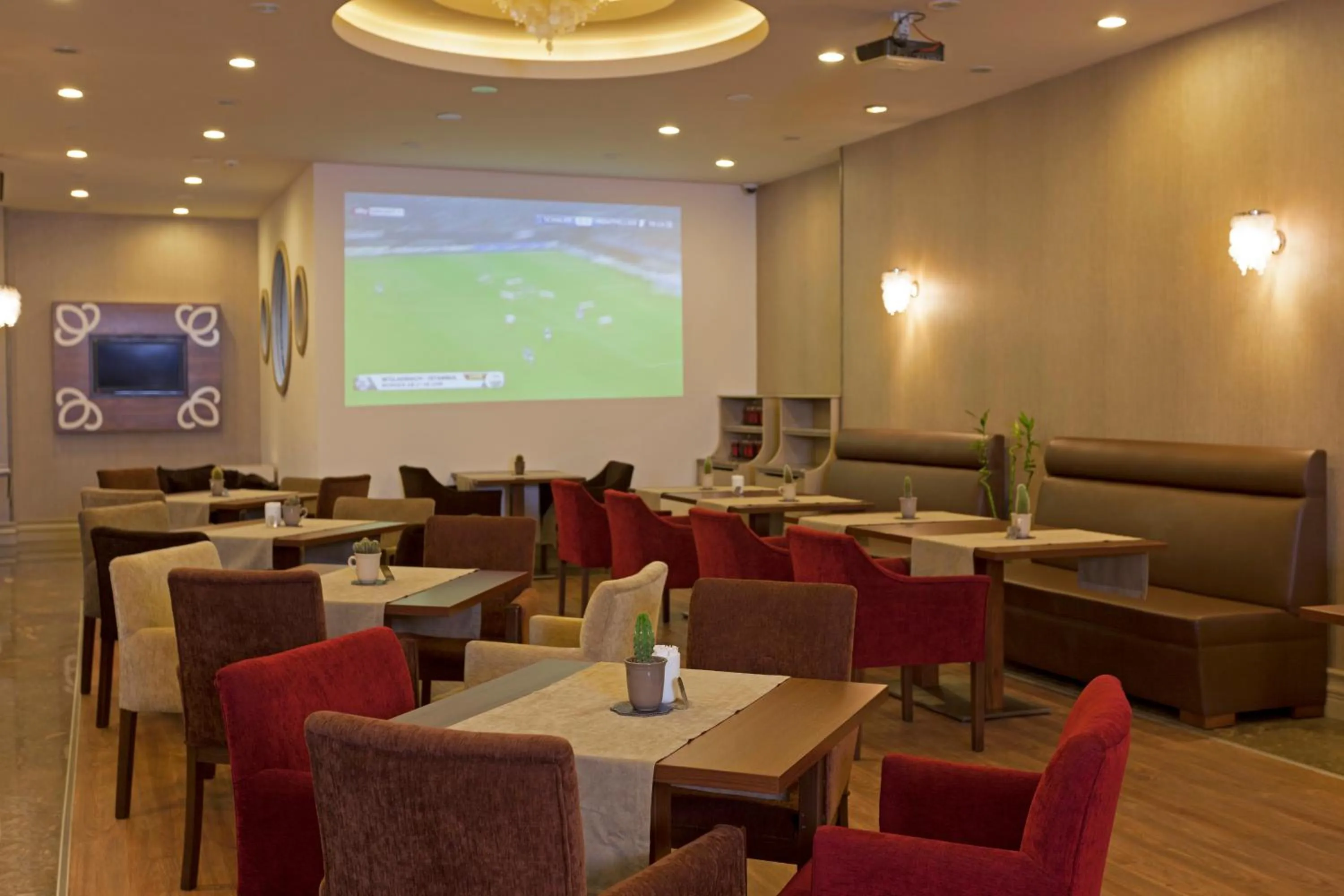 Communal lounge/ TV room in Gardenia Hotel