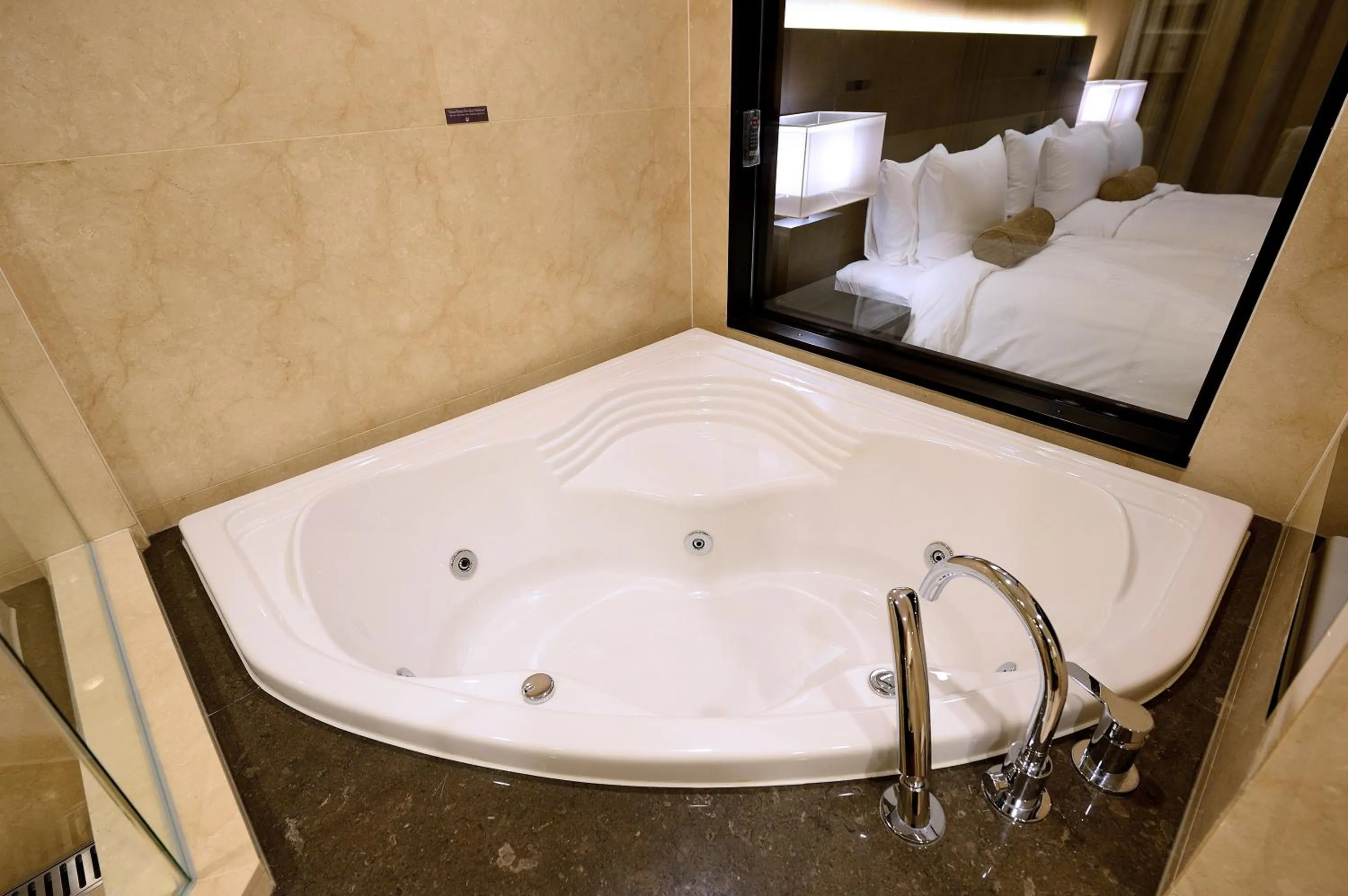 Bed in Midas Hotel & Resort