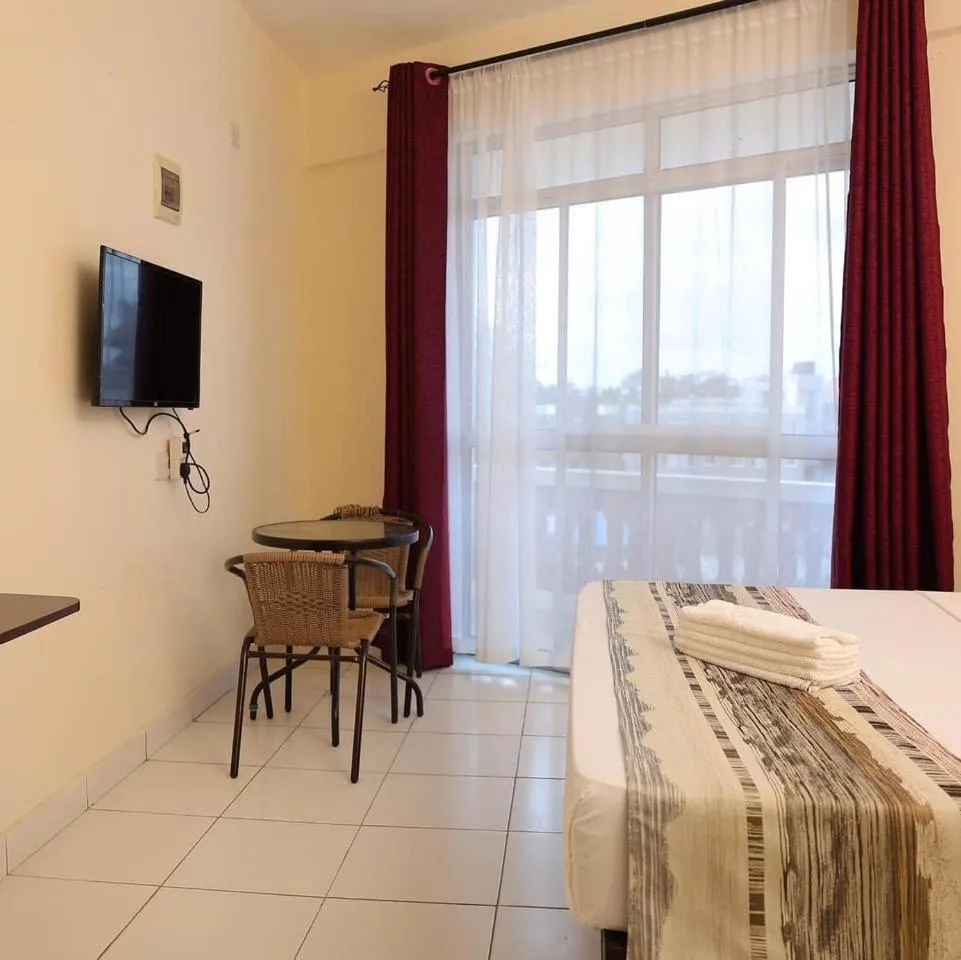 TV and multimedia, Bed in Merry Villa Hotel & Apartments