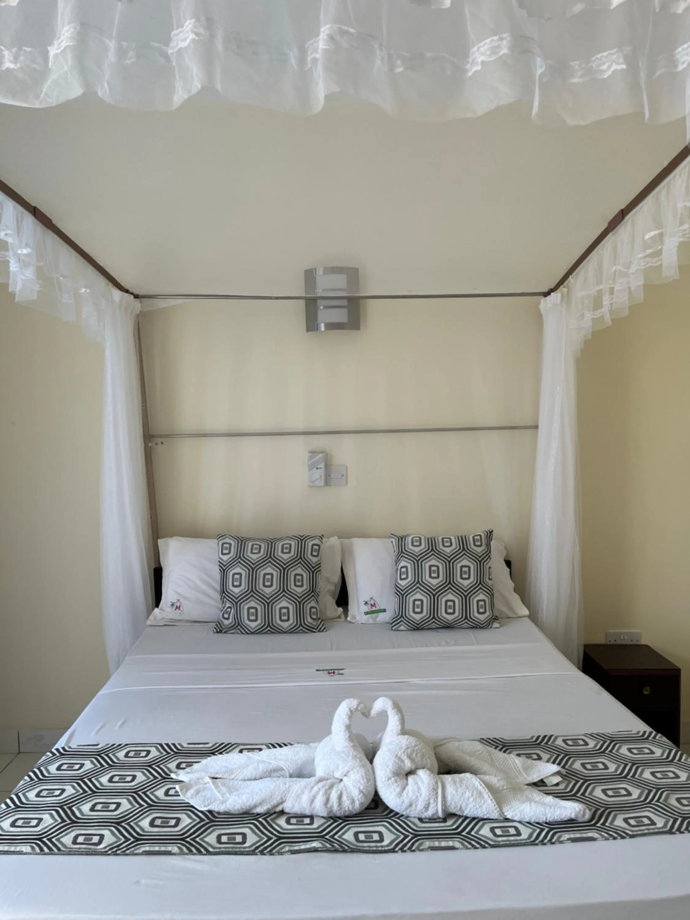 Bed in Merry Villa Hotel & Apartments