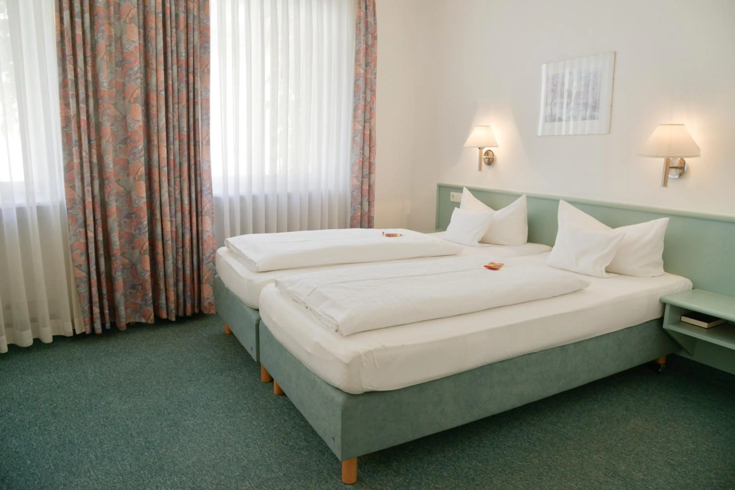 Bed in Hotel Till Eulenspiegel - Nichtrauchhotel - Garni