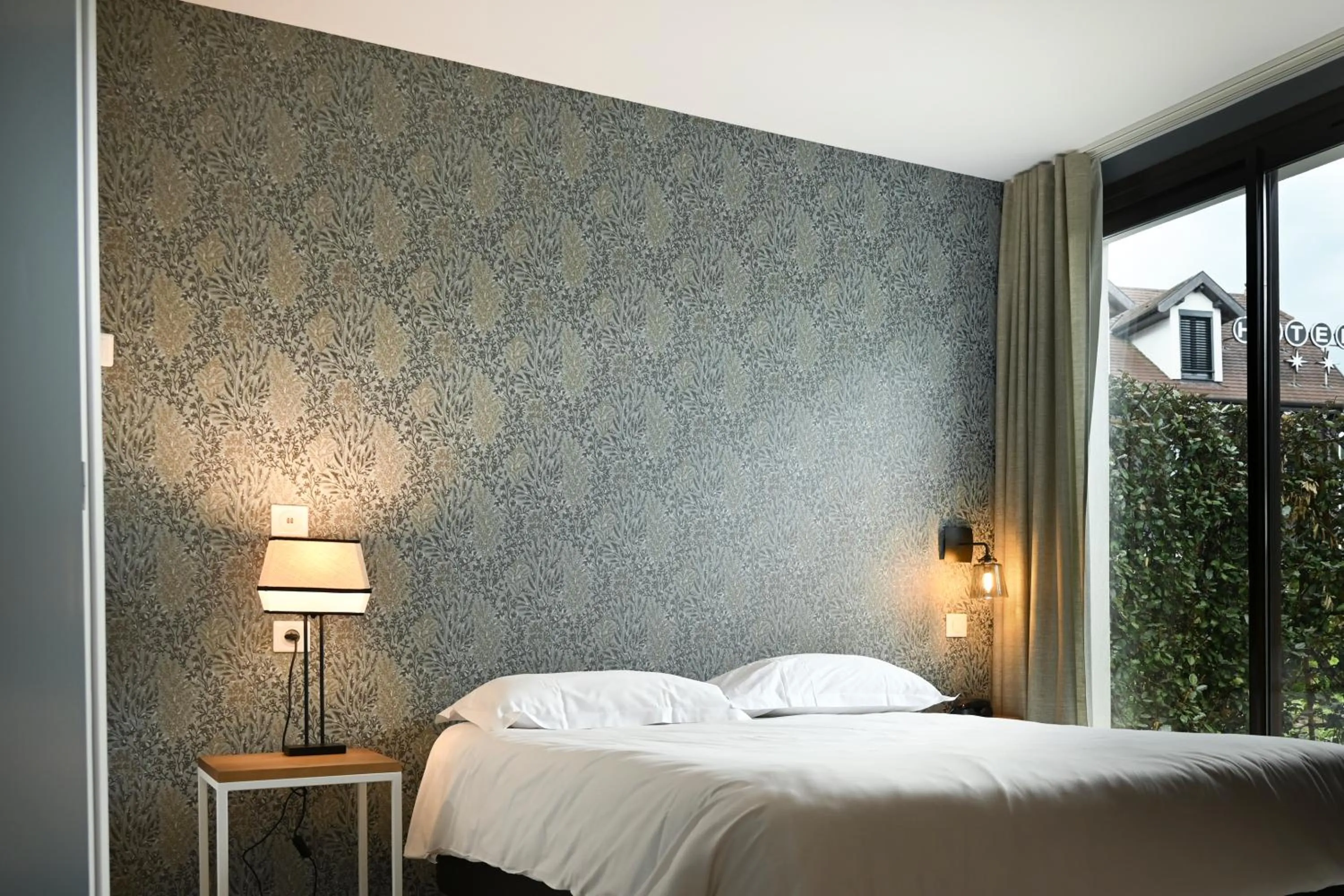 Bed in Hôtel Les Muses