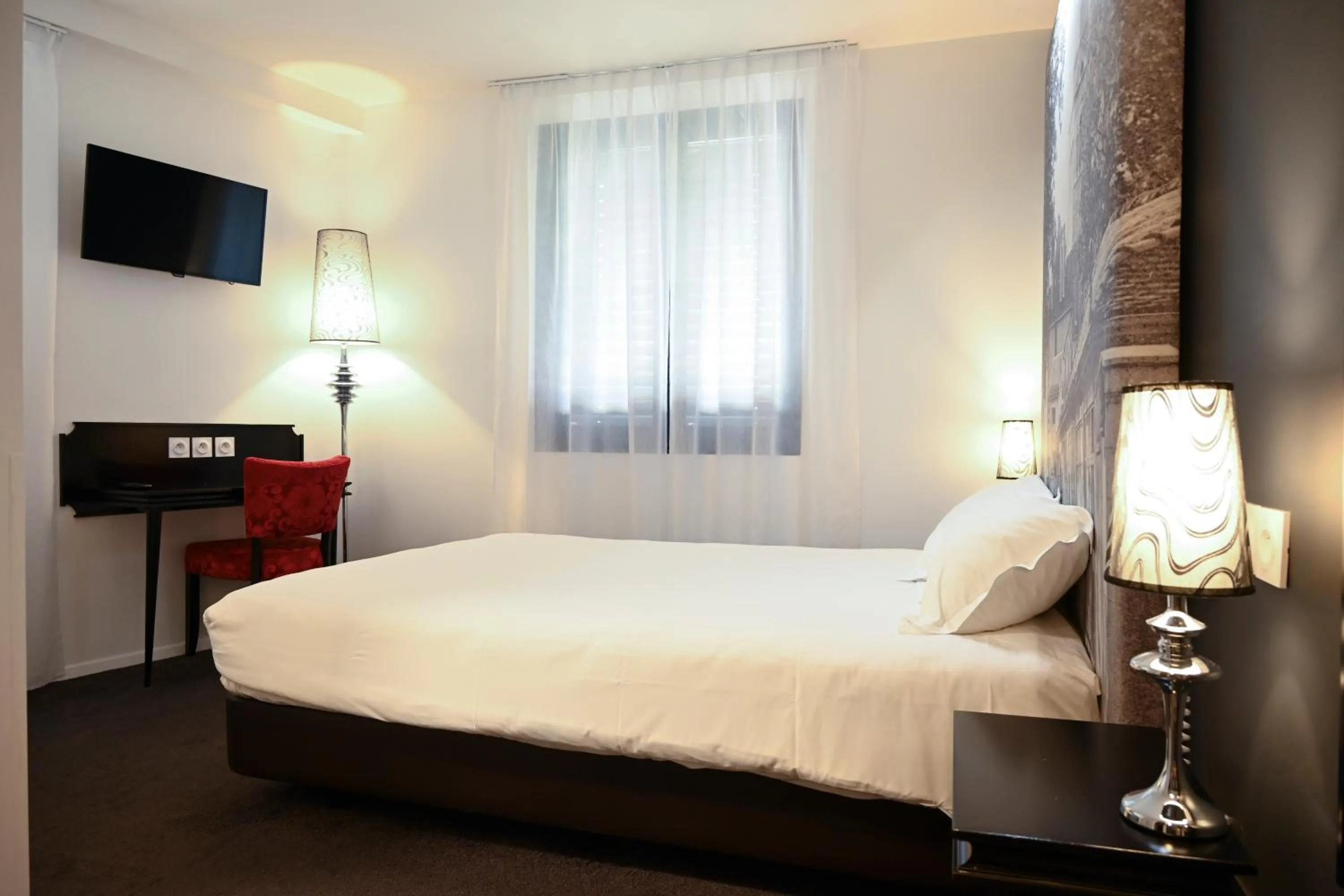 Bed in Hôtel Les Muses