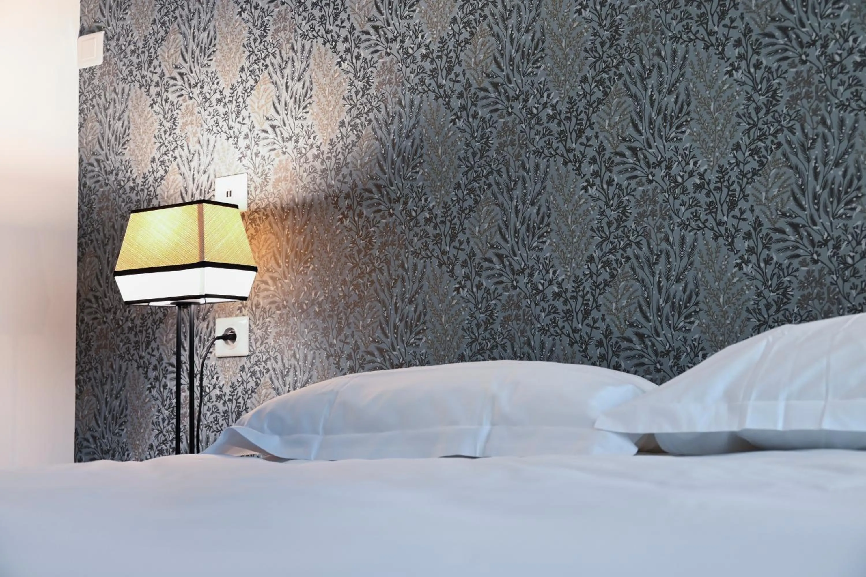 Bed in Hôtel Les Muses