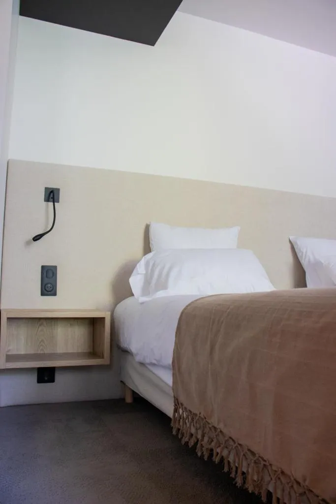 Bed in Hôtel Les Muses
