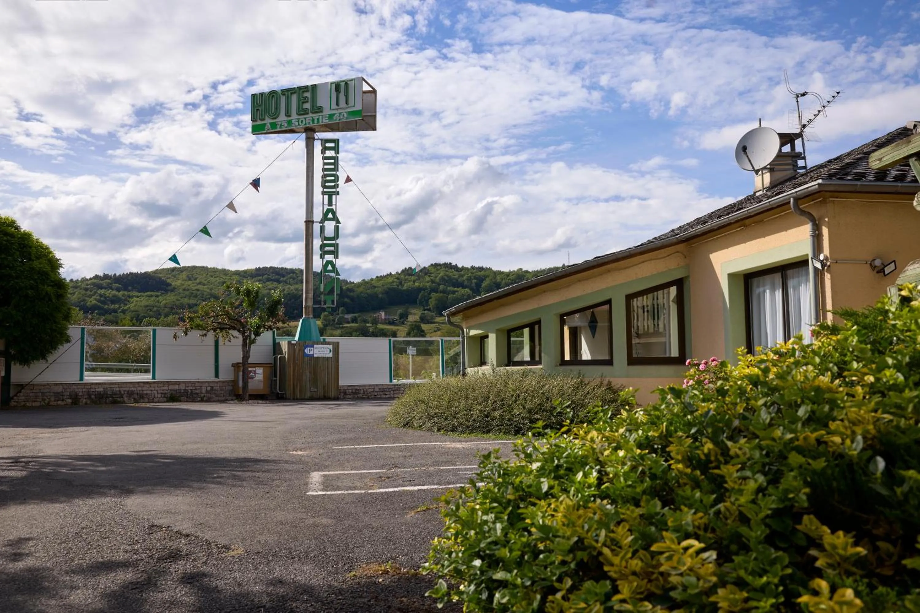 Property building in Hôtel-Restaurant Le Calice Du Gevaudan - A75