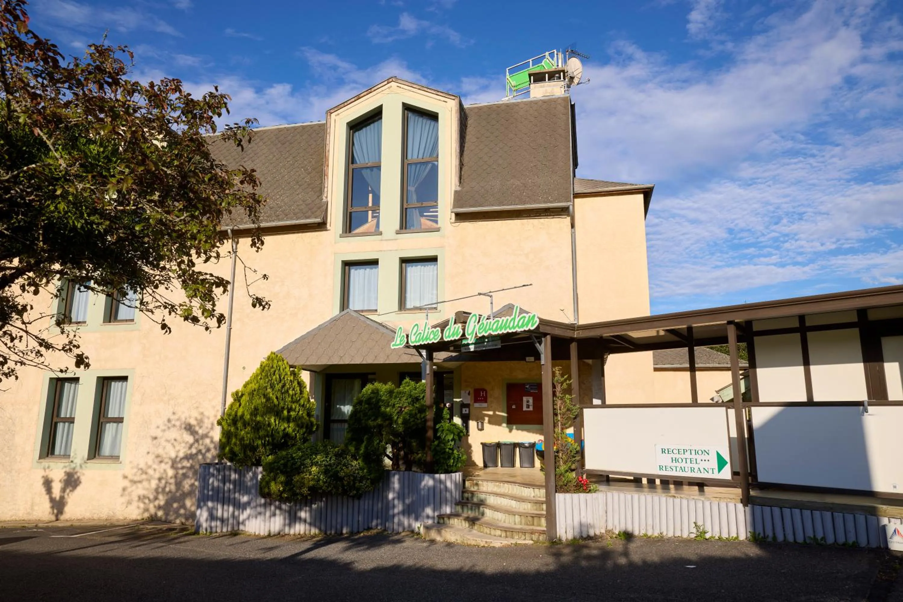 Property building in Hôtel-Restaurant Le Calice Du Gevaudan - A75