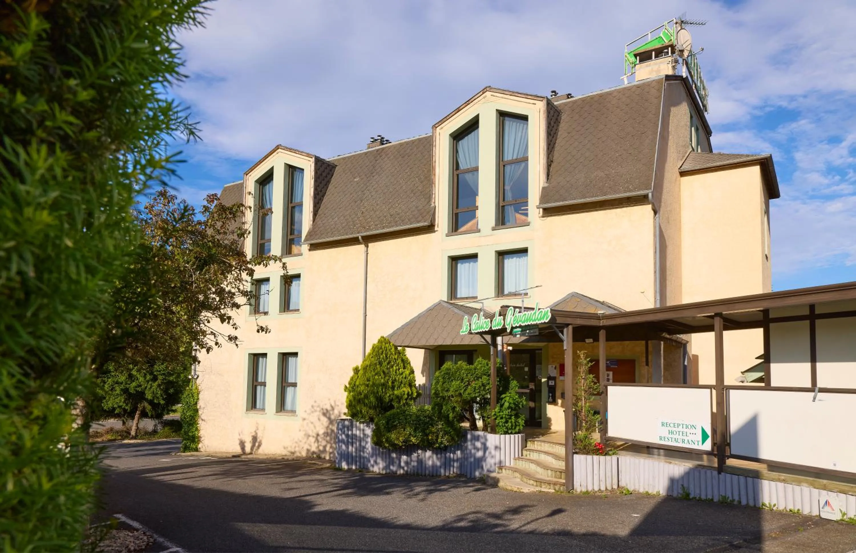 Property building in Hôtel-Restaurant Le Calice Du Gevaudan - A75