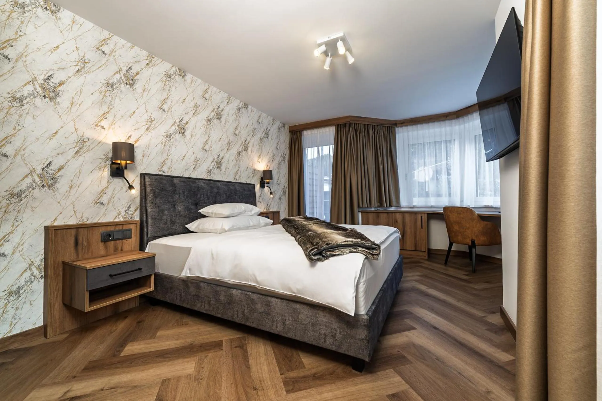 Bed in Hotel Vier Jahreszeiten