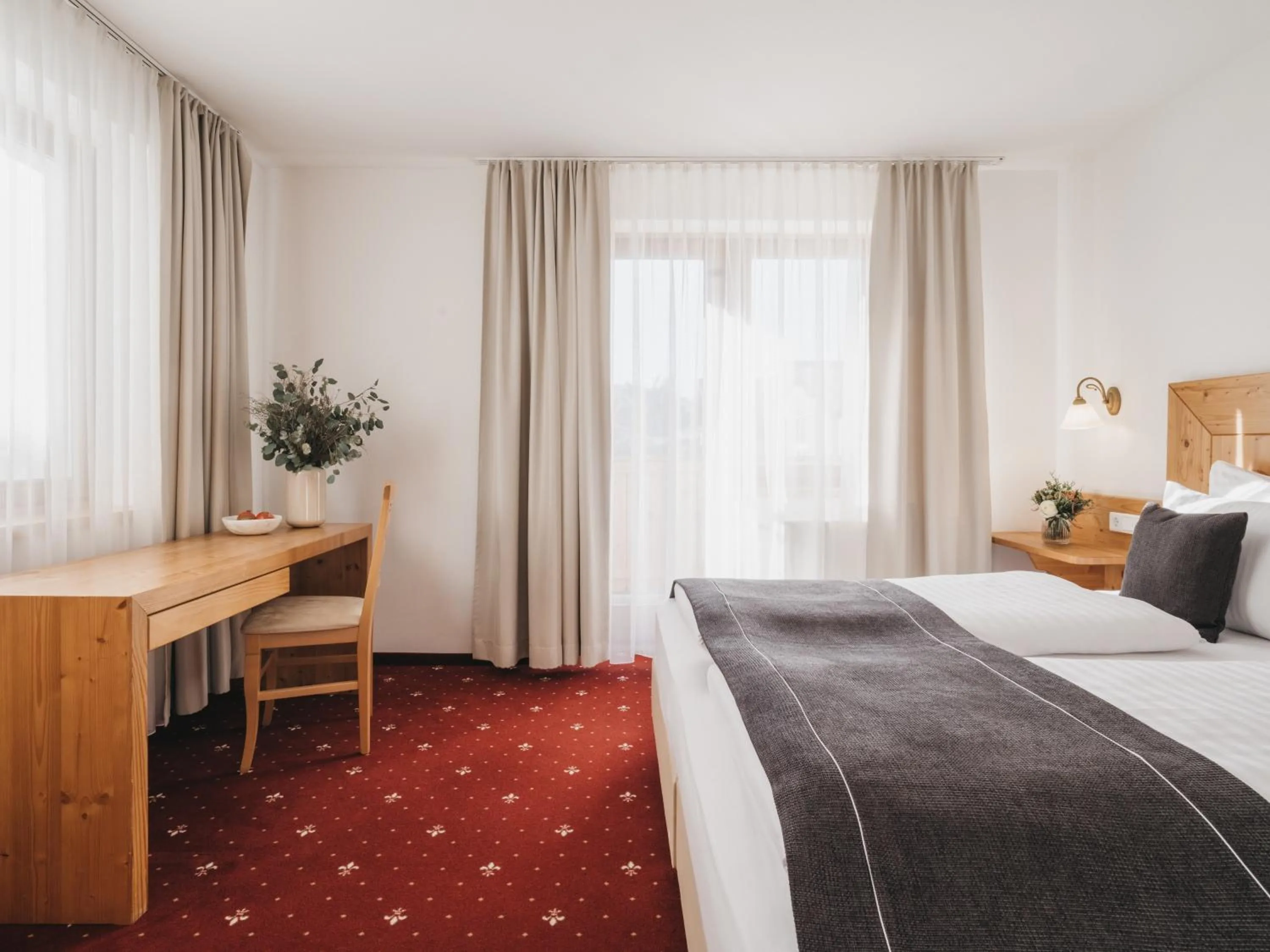 Bed in Hotel Vier Jahreszeiten by VAYA