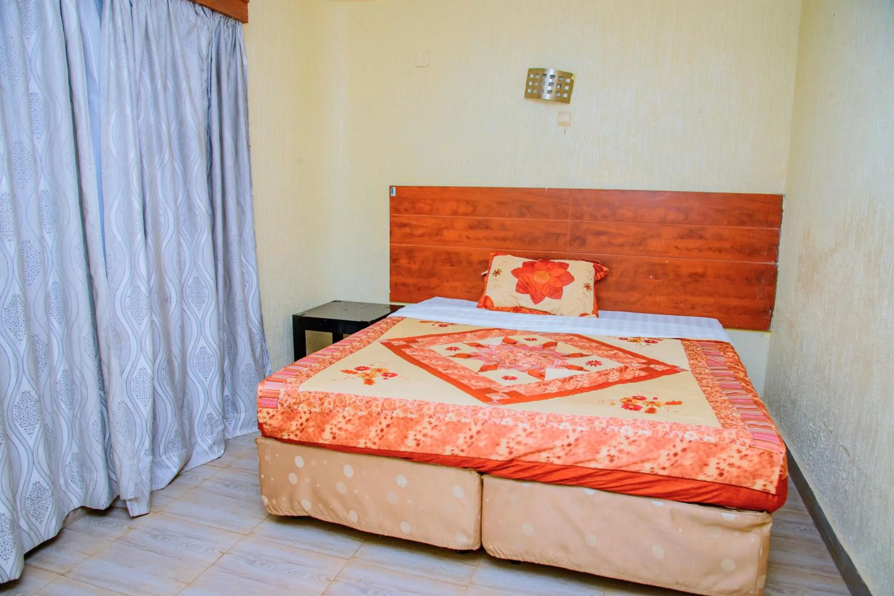 Bed in Diplomat Apartments