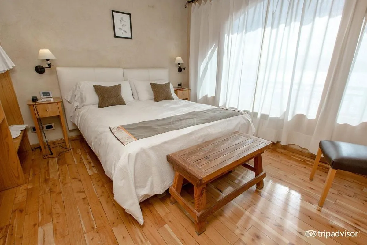 Bed in Lirolay Suites - Apart Hotel