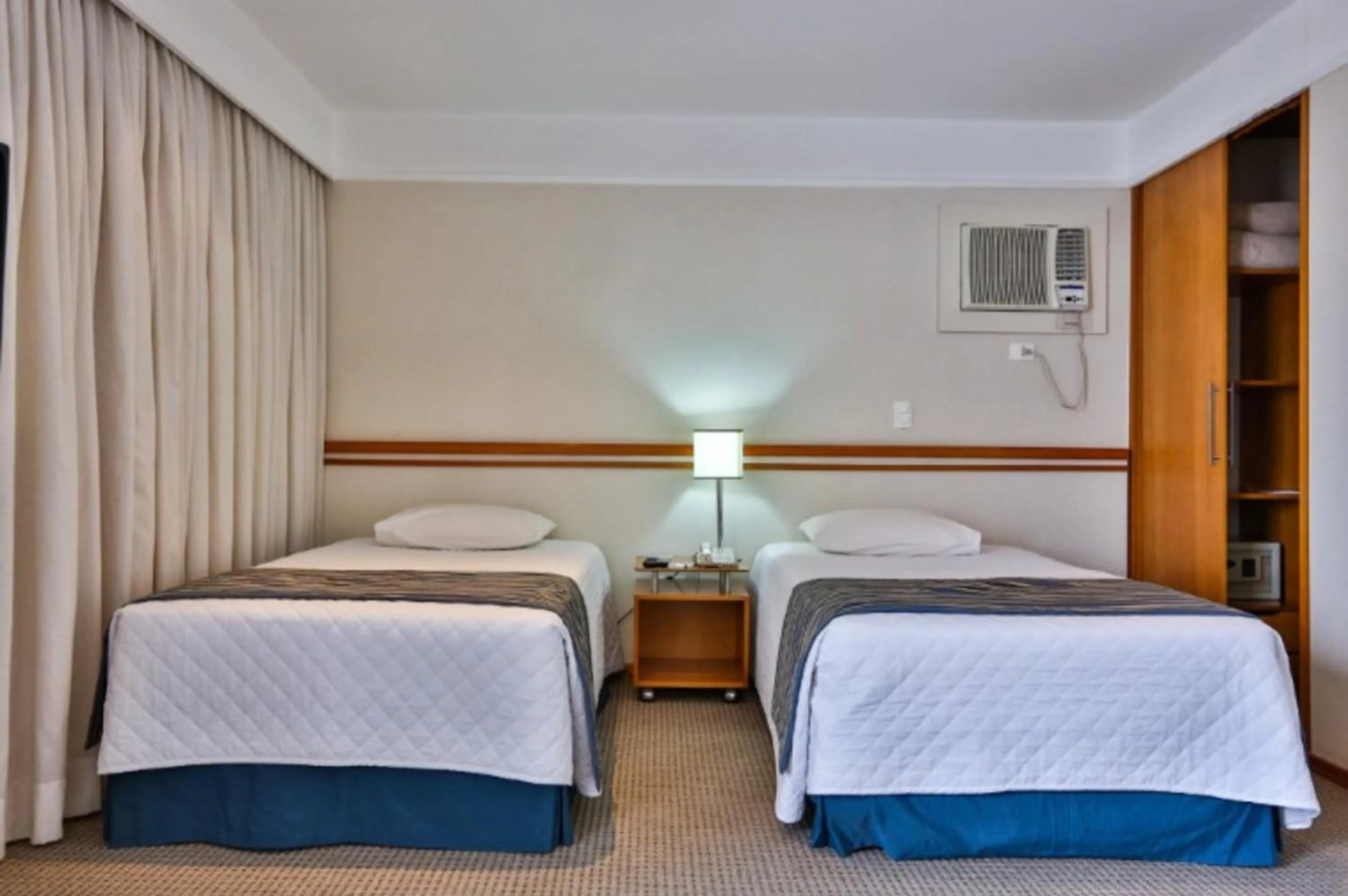 Bed in eSuites Sorocaba by Atlantica