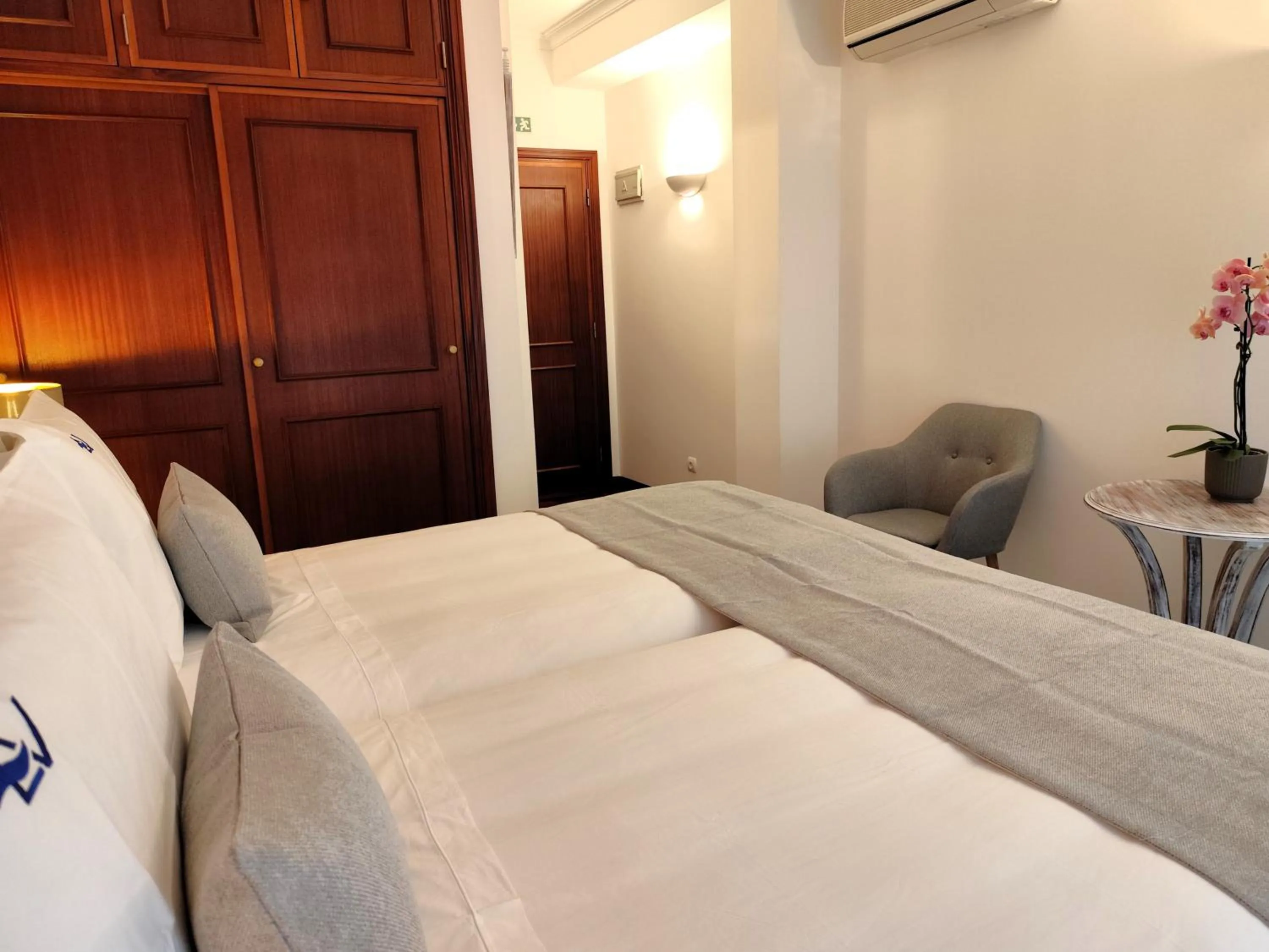 Bed in Luso Village Boutique Hotel