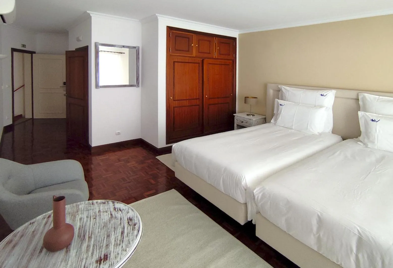 Bed in Luso Village Boutique Hotel