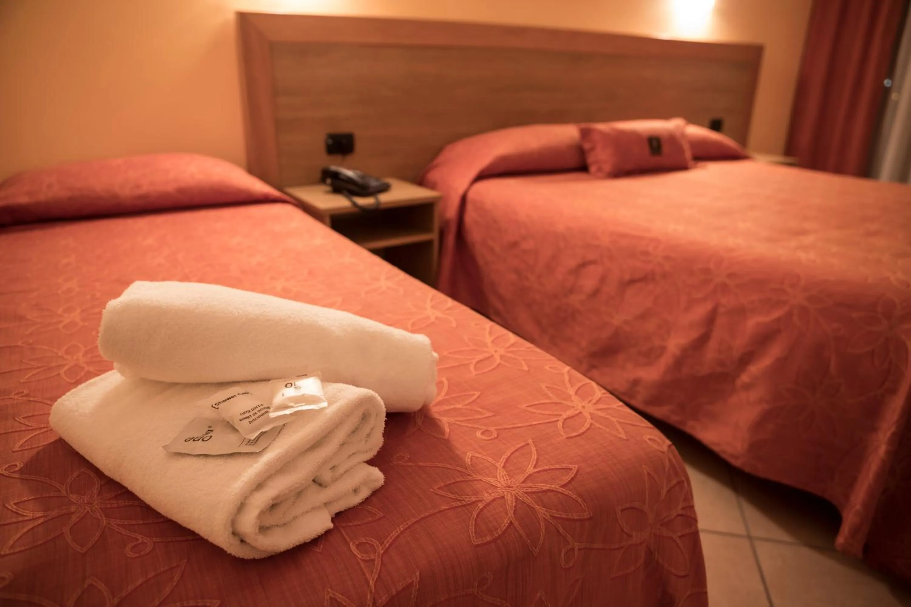 Bed in Manhattan Village Hotel