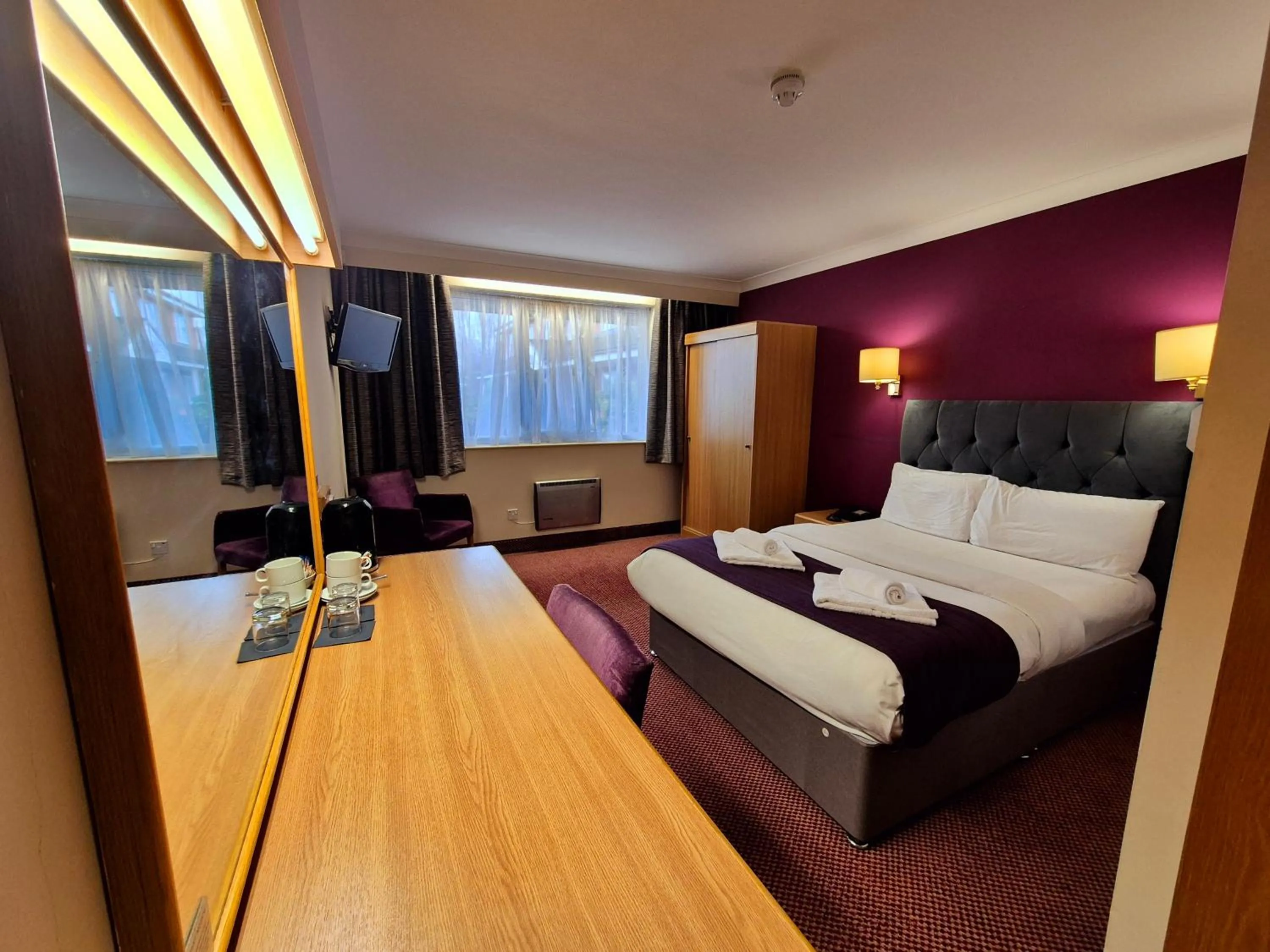 Bed in Supreme Inn Boston