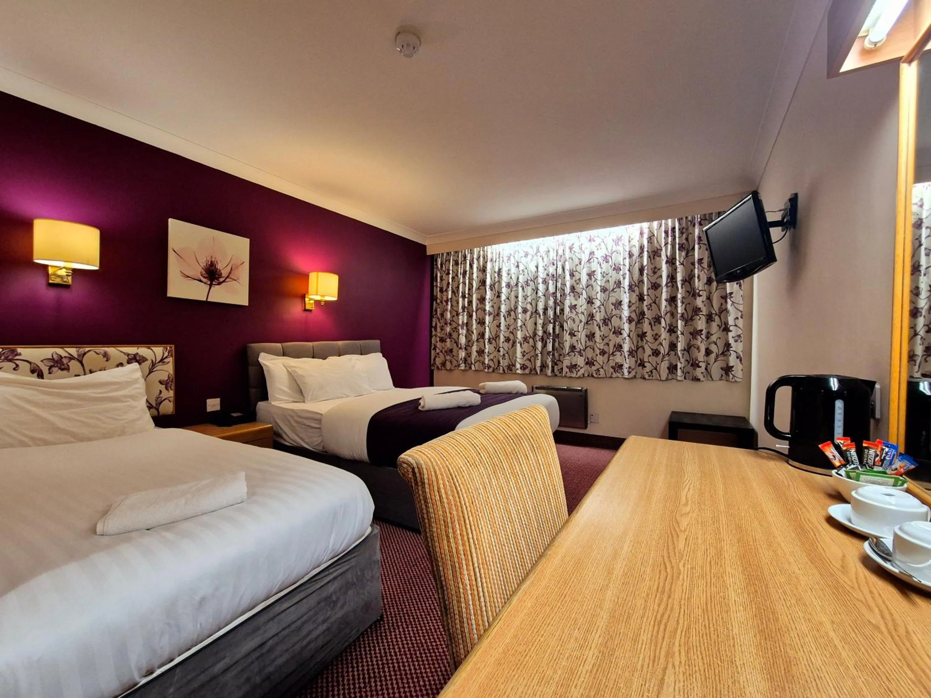 Bed in Supreme Inn Boston