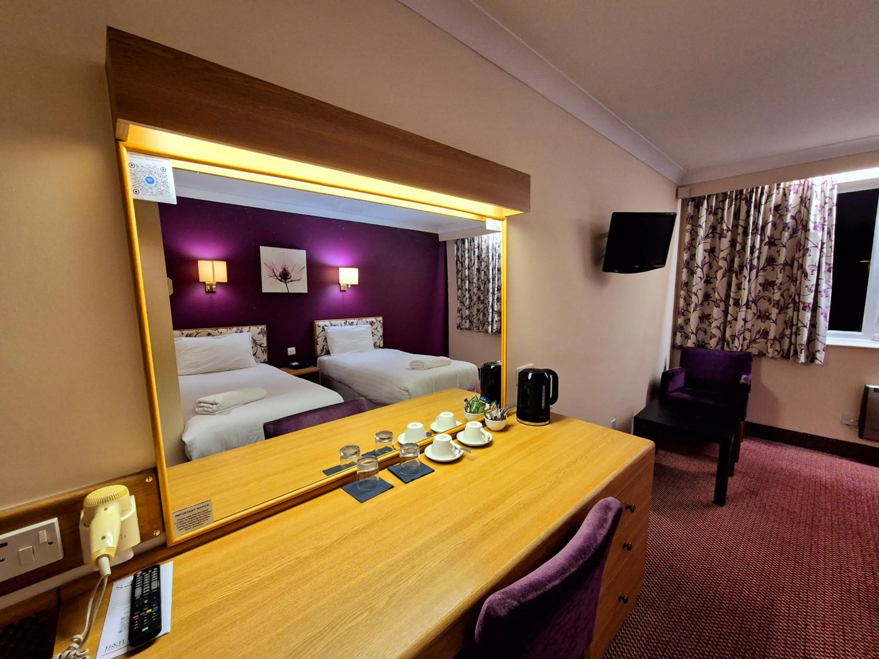 Bed in Supreme Inn Boston