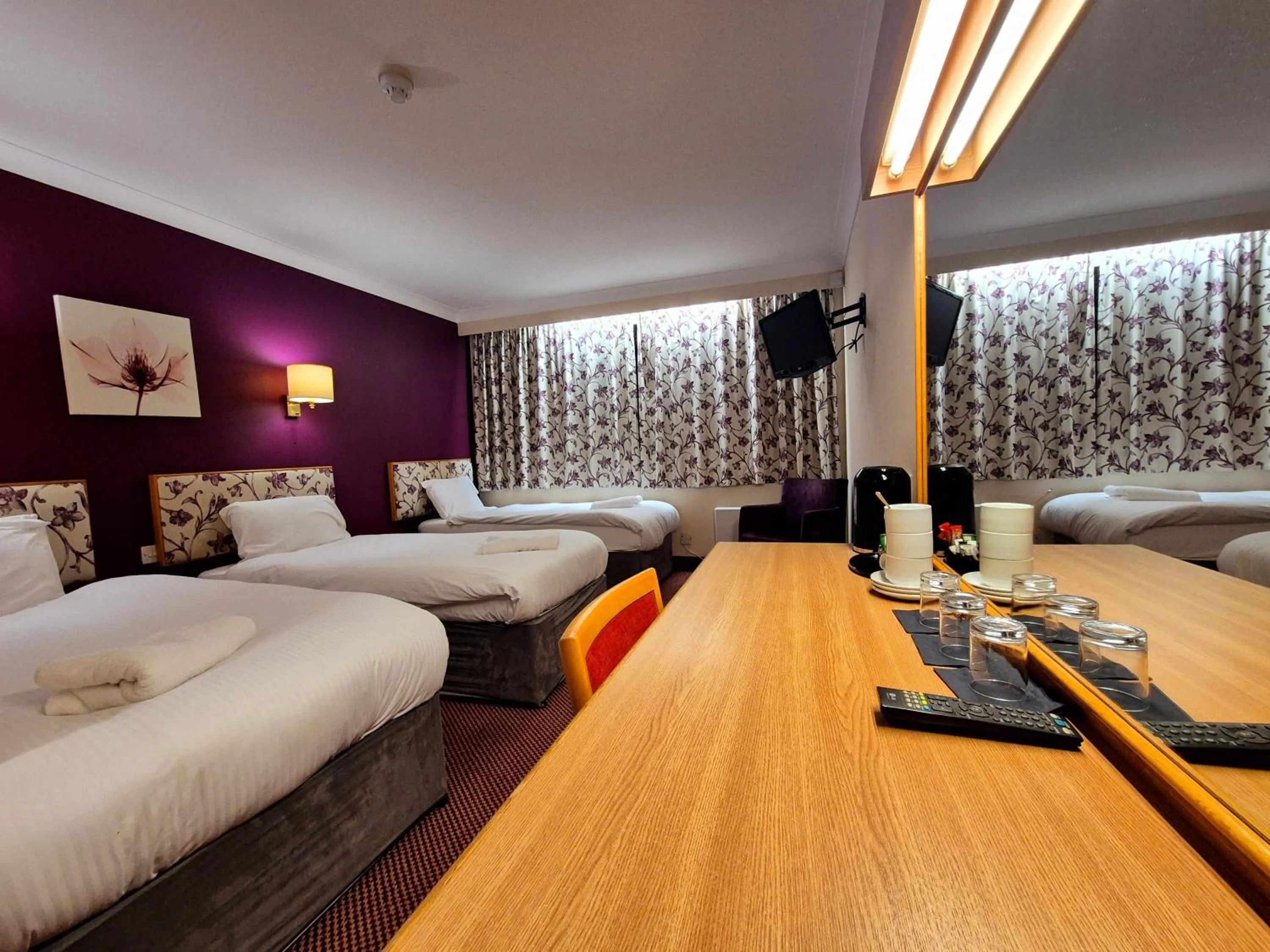 Bed in Supreme Inn Boston