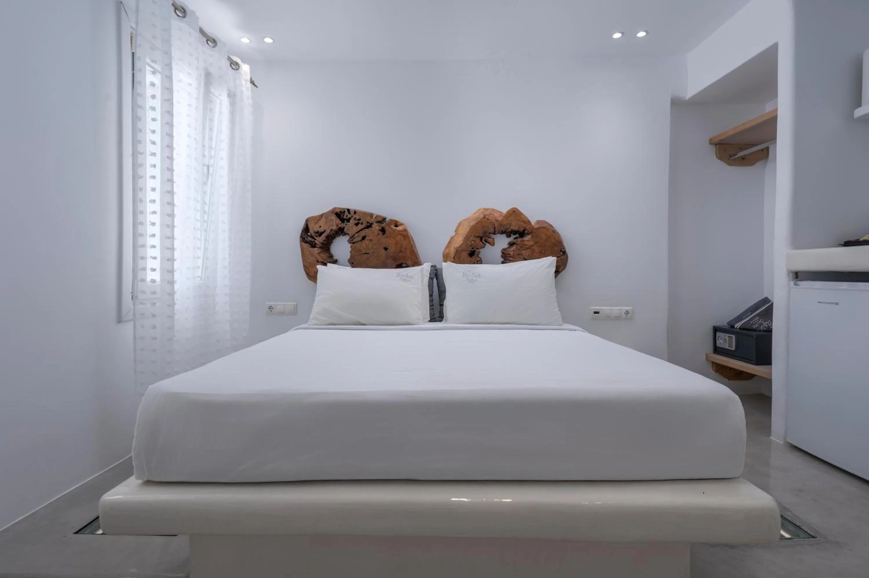 Bed in Flaskos Luxury Suites