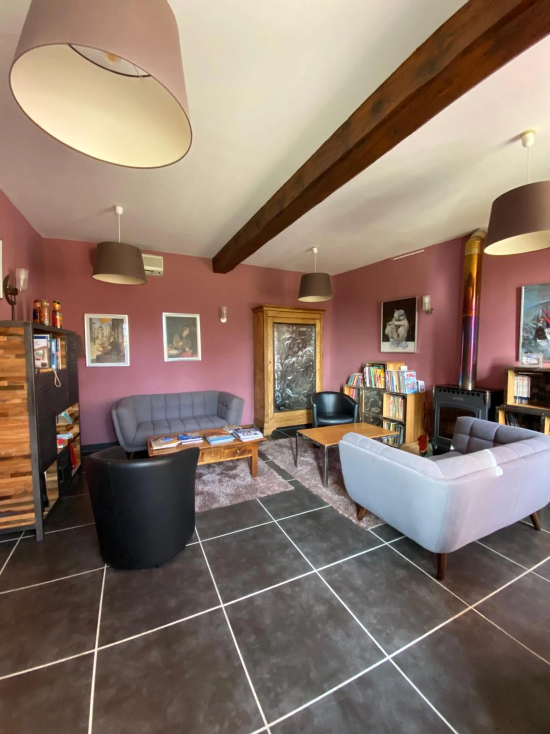 Communal lounge/ TV room in Logis Hôtel Château De Palaja