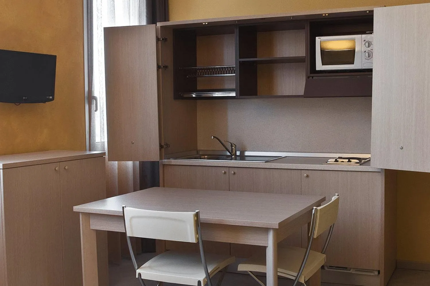 Kitchen or kitchenette in Silver Residence Hotel