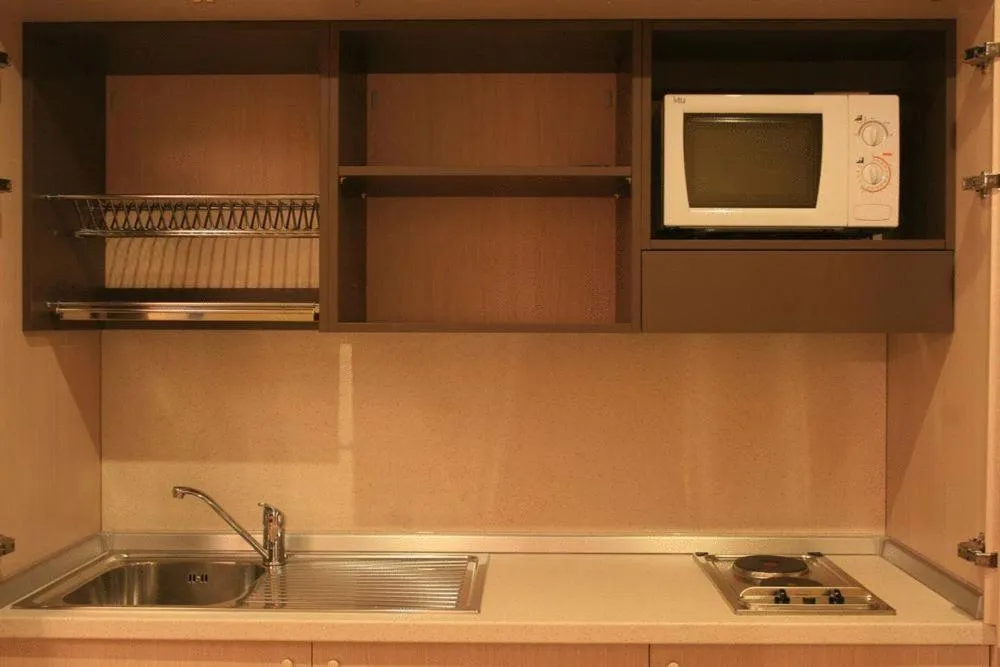 Kitchen or kitchenette in Silver Residence Hotel