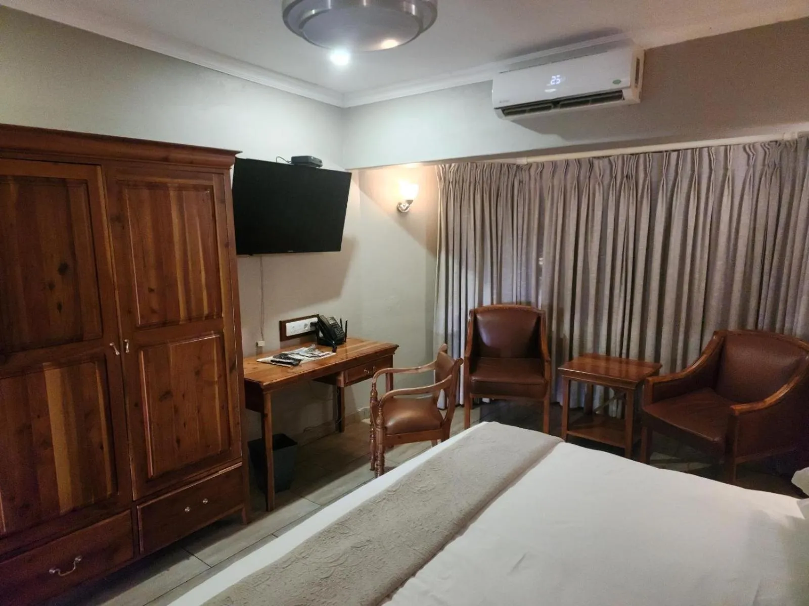 Seating area, Bed in Fairview Hotels,Spa & Golf Resort