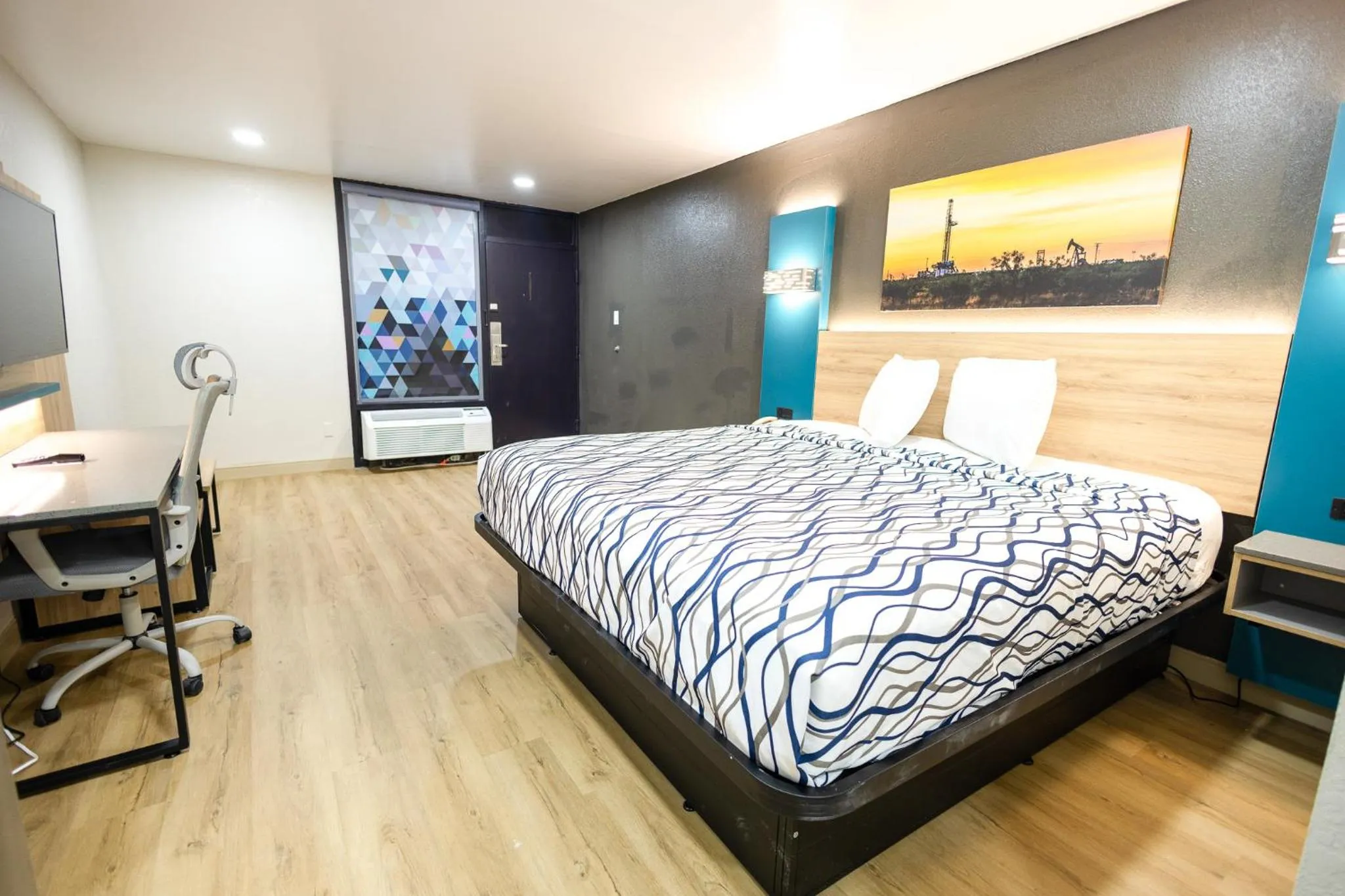 Bed in West Texas Inn & Suites with Kitchenette