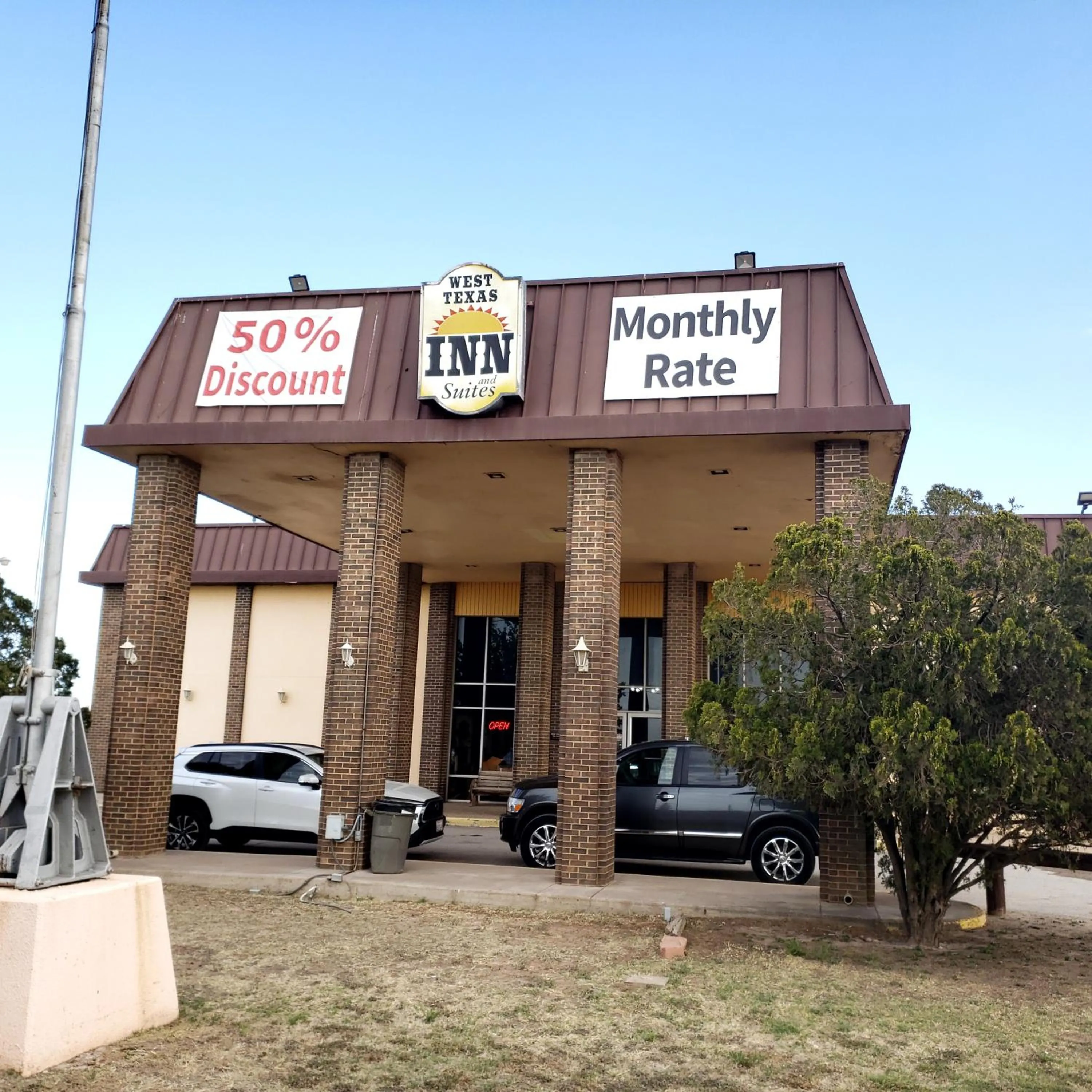 Property building in West Texas Inn & Suites with Kitchenette