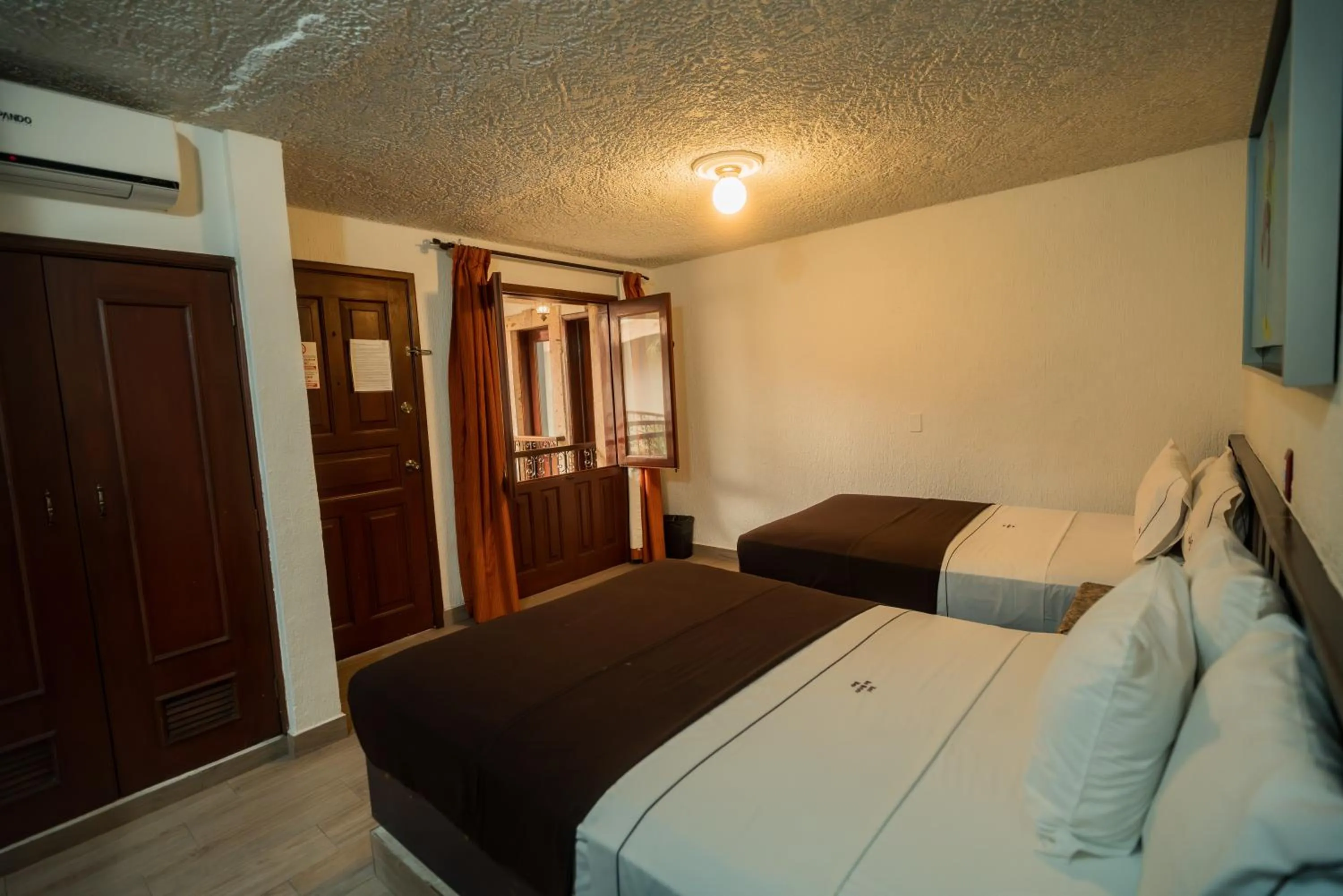 Bed in Hotel Don Quijote Plaza - Guadalajara Centro Historico