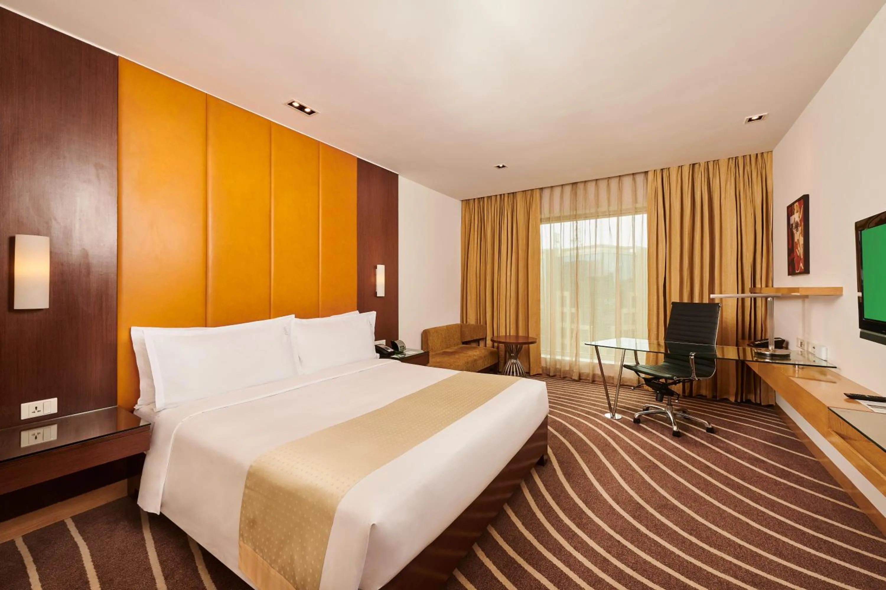 Photo of the whole room, Bed in Holiday Inn Mumbai International Airport by IHG