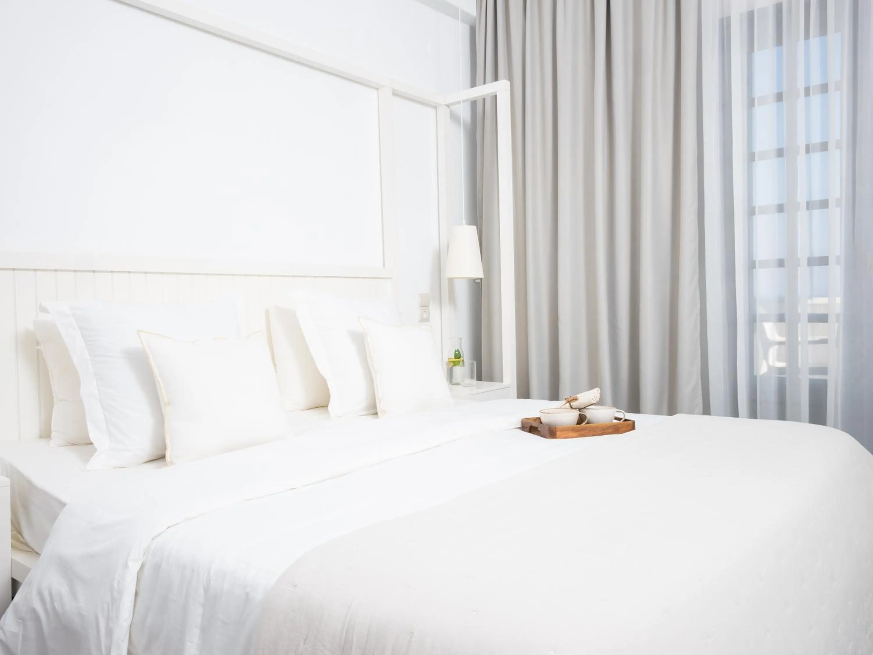 Bed in White Suites Resort- Adults Only Hotel