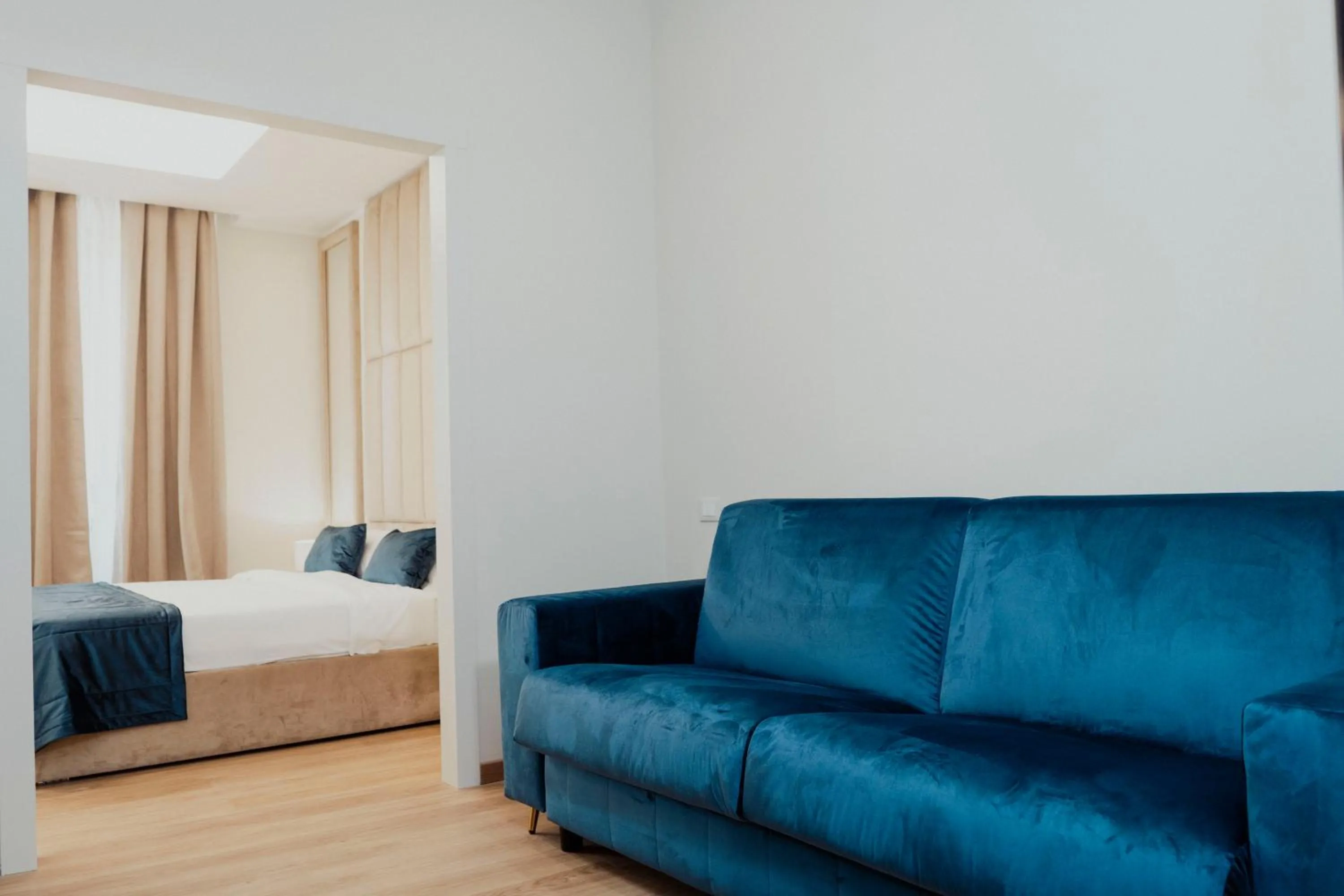 Living room, Bed in Cesare ai Cavalieri Suites