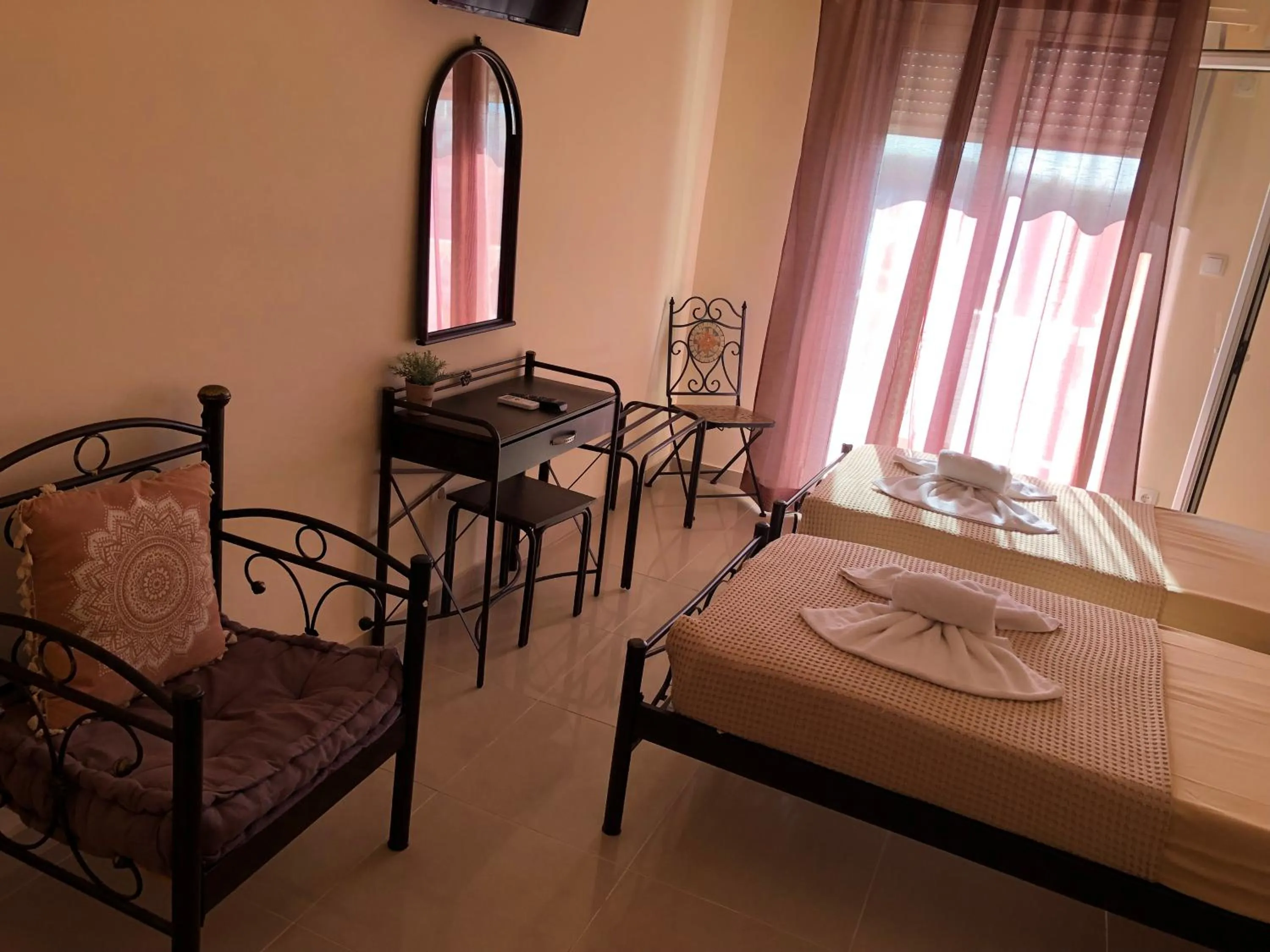 Bed in Nikolakakis Rooms Lavrio