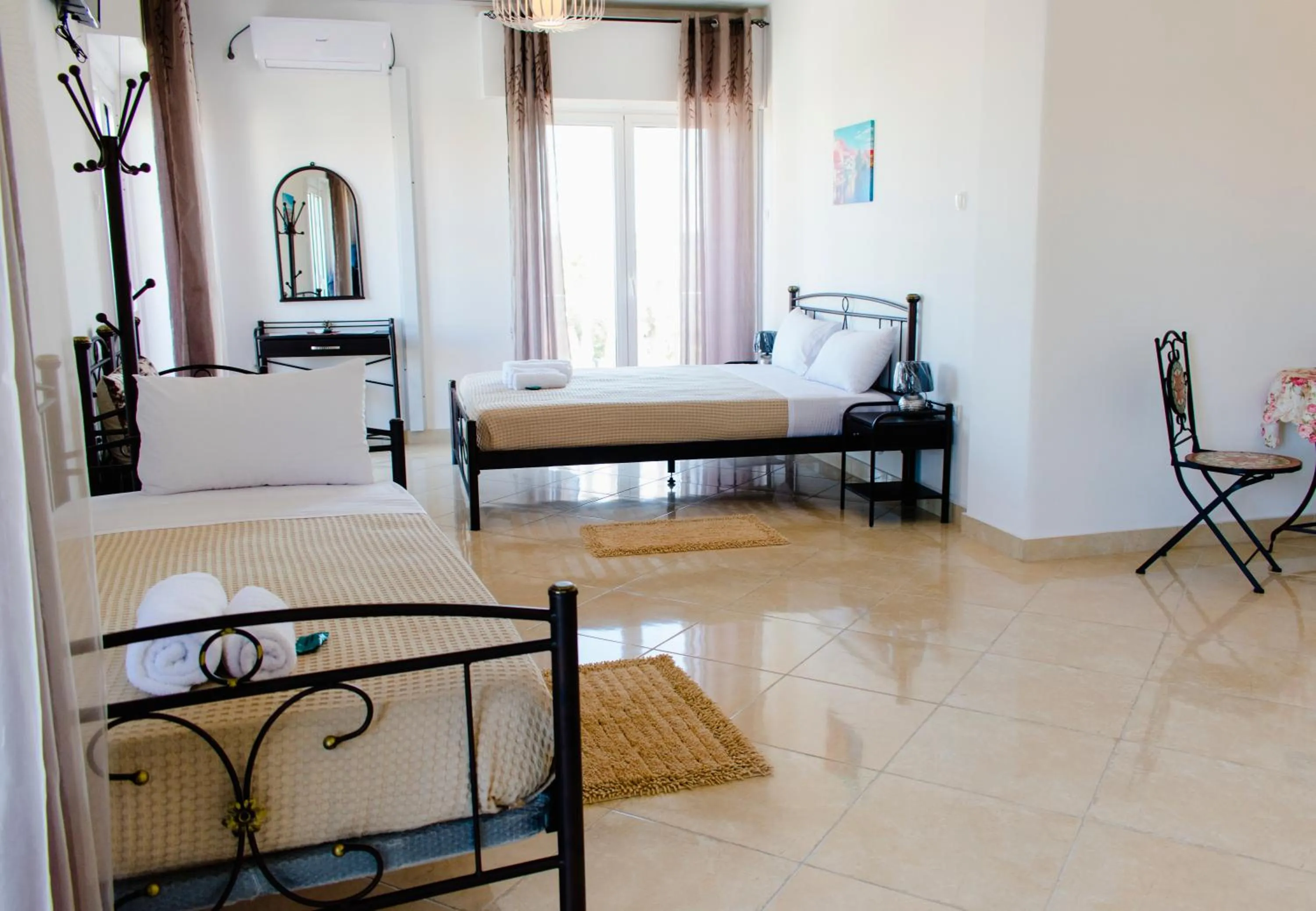 Bed in Nikolakakis Rooms Lavrio