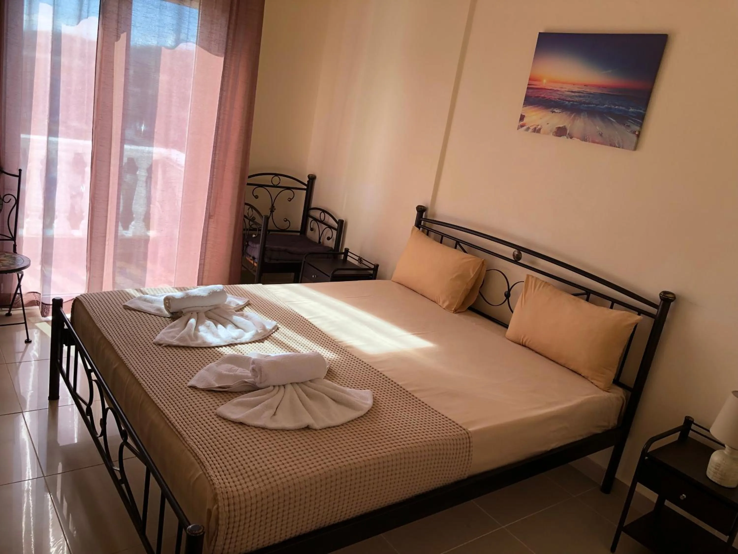 Bed in Nikolakakis Rooms Lavrio