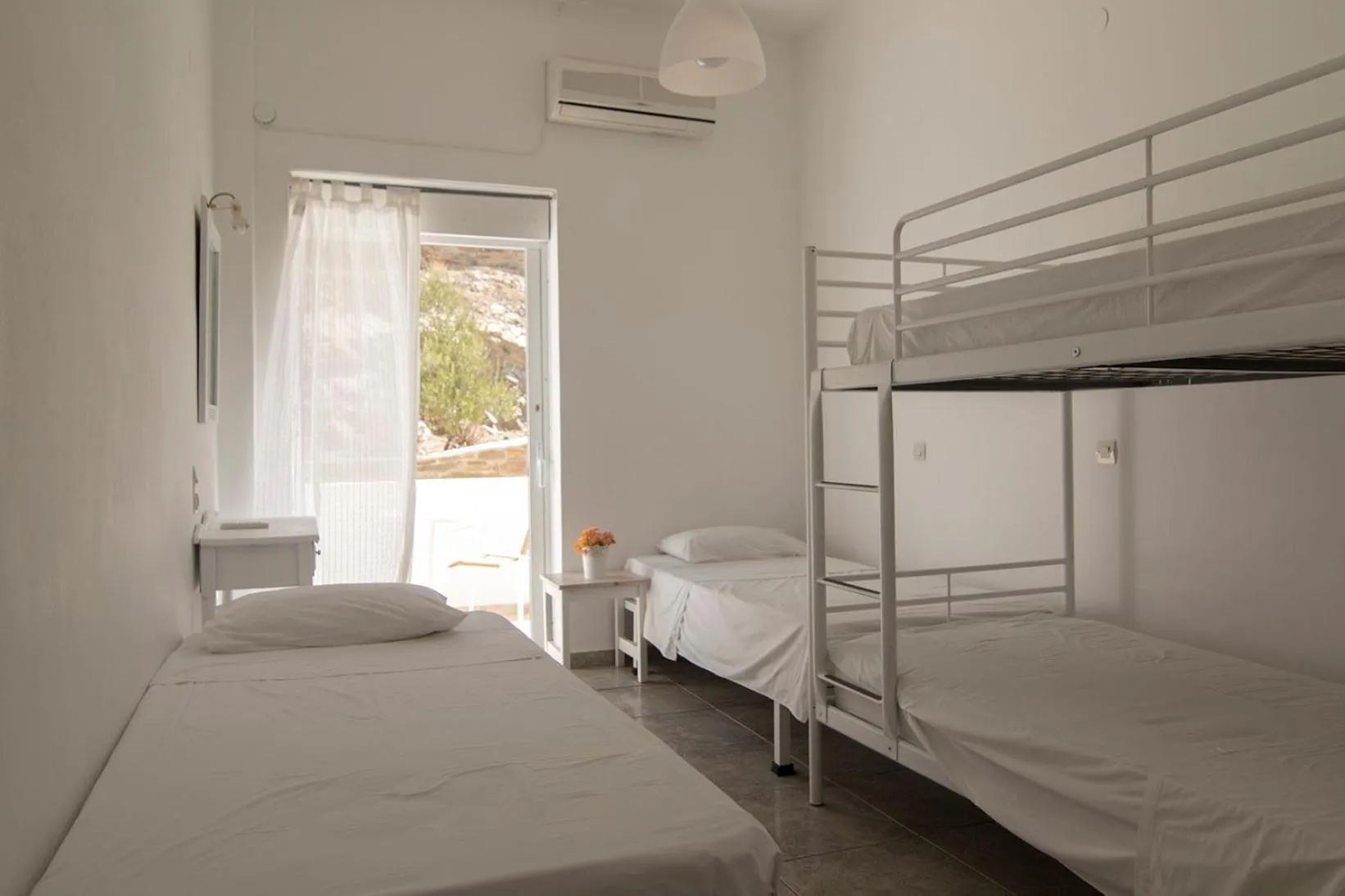 Photo of the whole room, Bed in Armadoros Hotel / Ios Backpackers