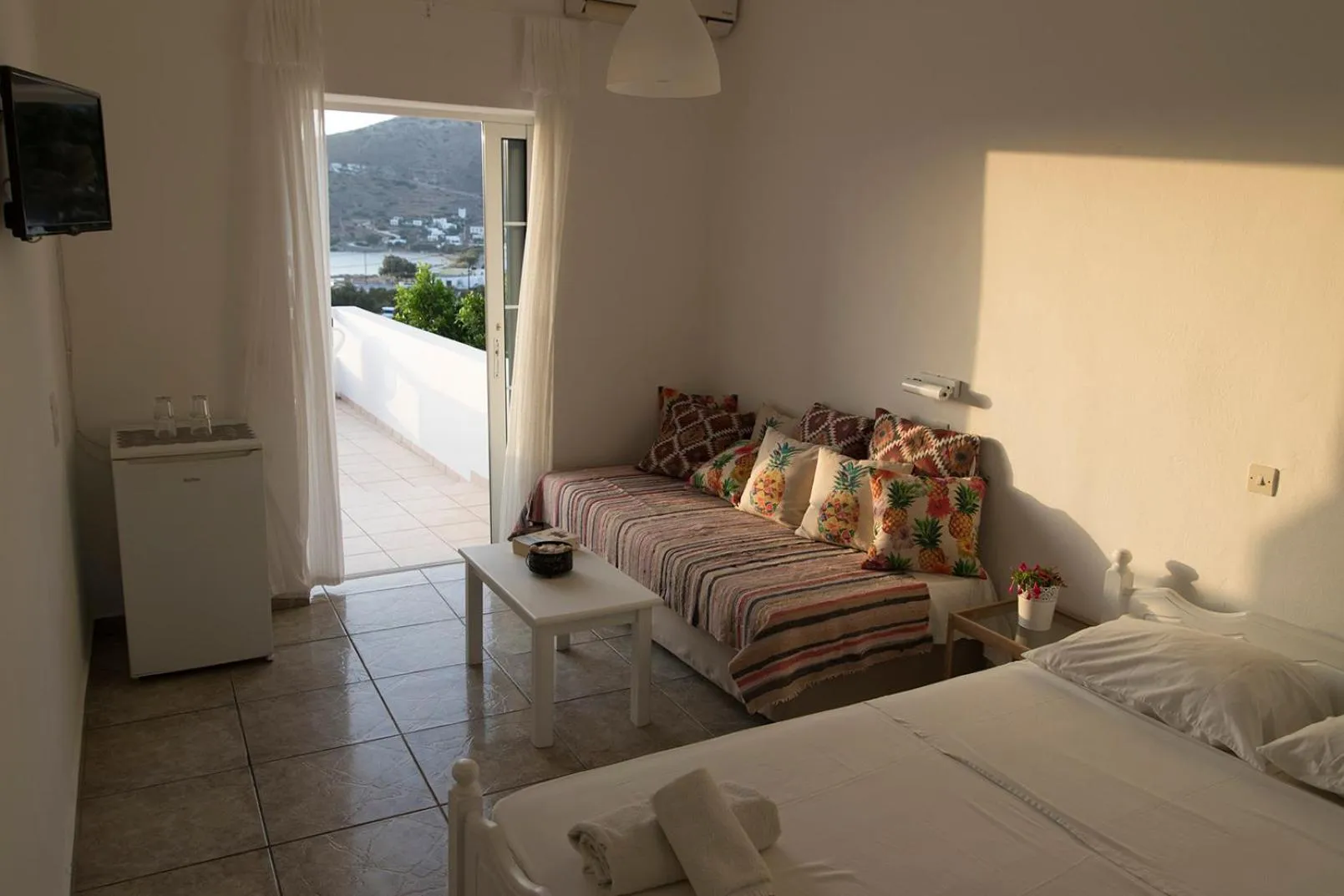 Seating area, Bed in Armadoros Hotel / Ios Backpackers