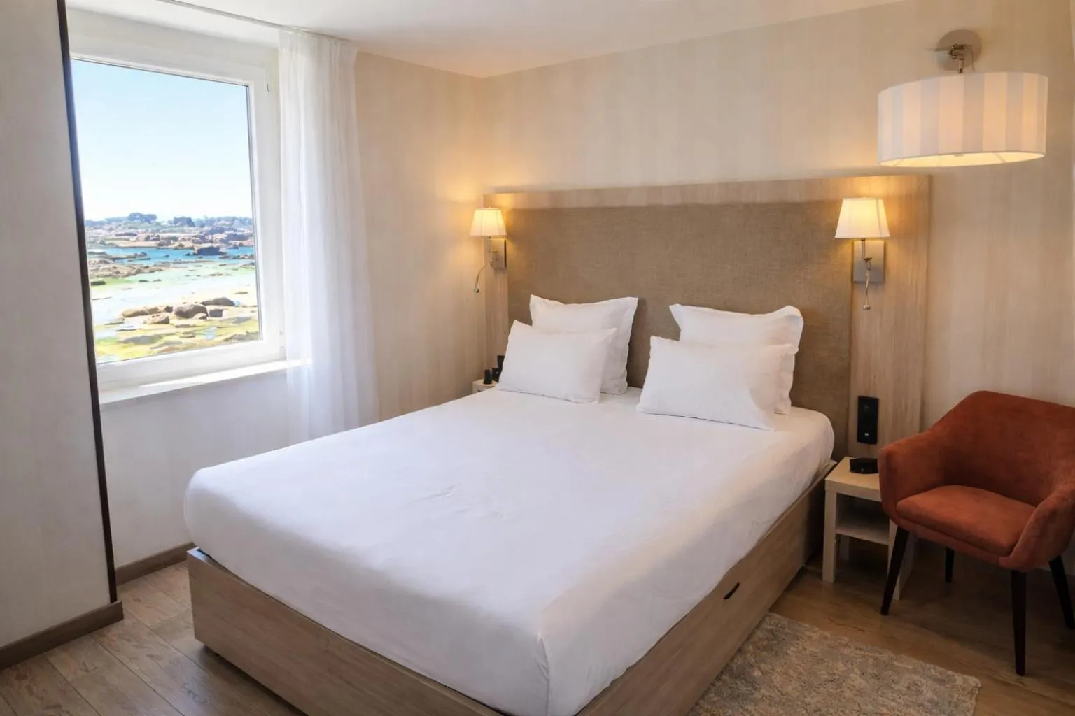 Bed in Logis Hôtel Saint Guirec Et De La Plage