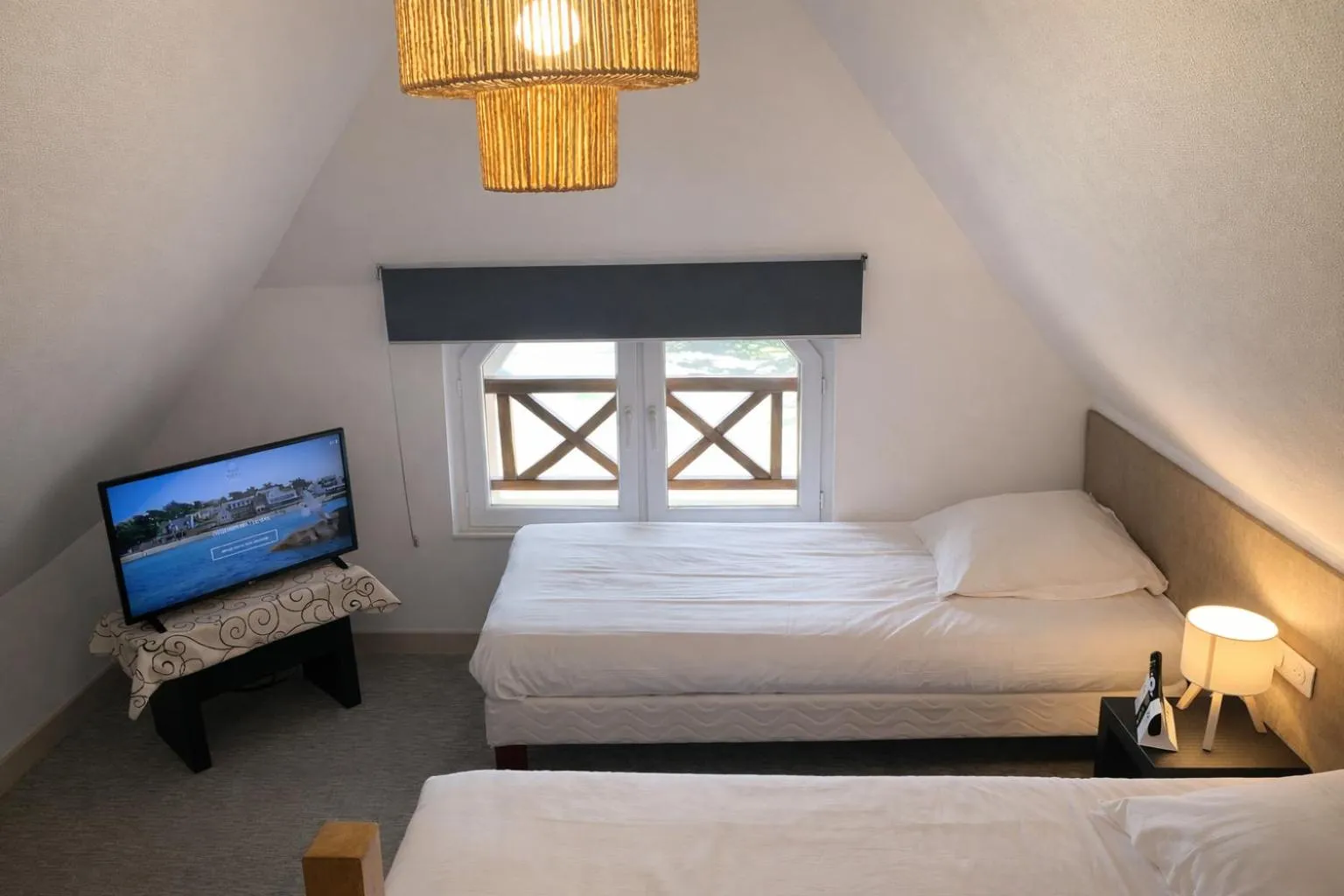 Bed in Logis Hôtel Saint Guirec Et De La Plage