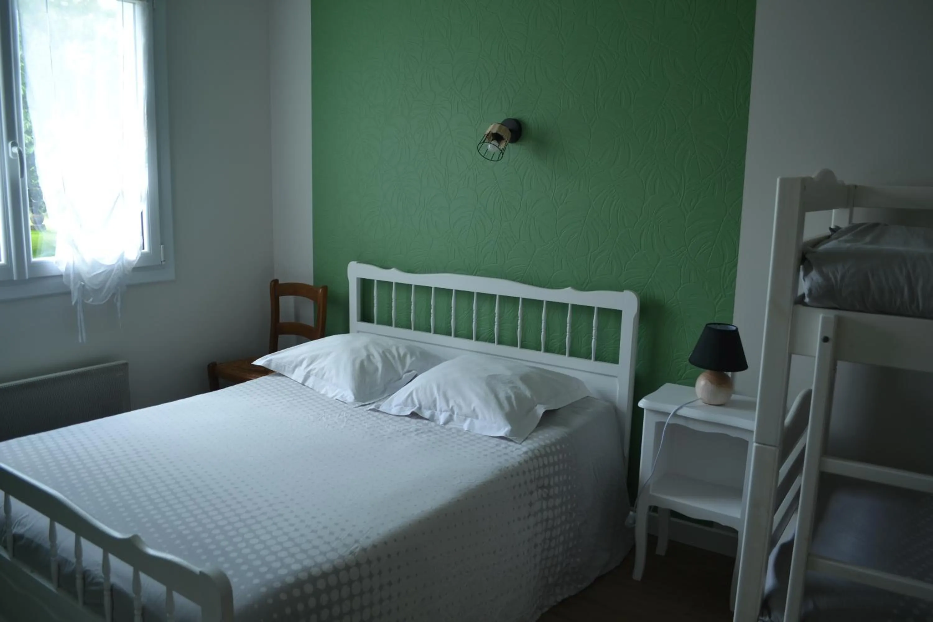 Bed in Chambre d'hôtes la ville en bois