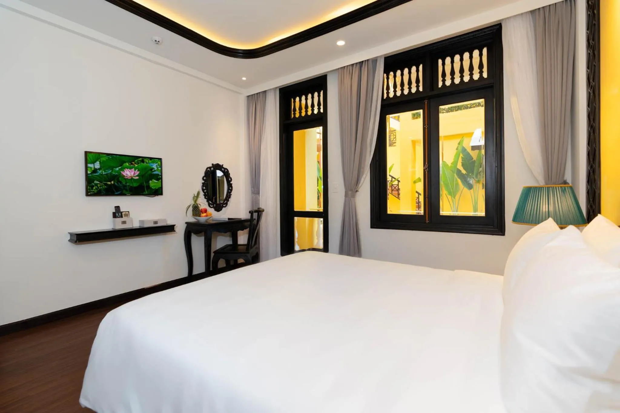 Communal lounge/ TV room, Bed in Oriental Boutique Hoi An