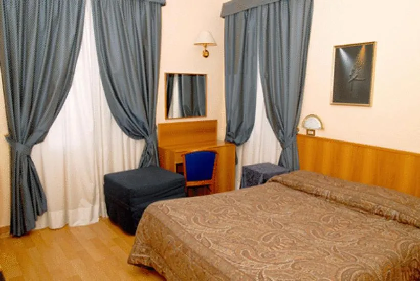 Photo of the whole room, Bed in Hotel Porziuncola