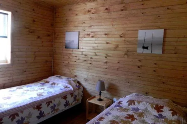 Bed in Merland Park Cottages and Motel