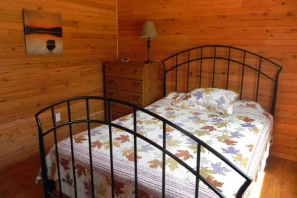 Bed in Merland Park Cottages and Motel