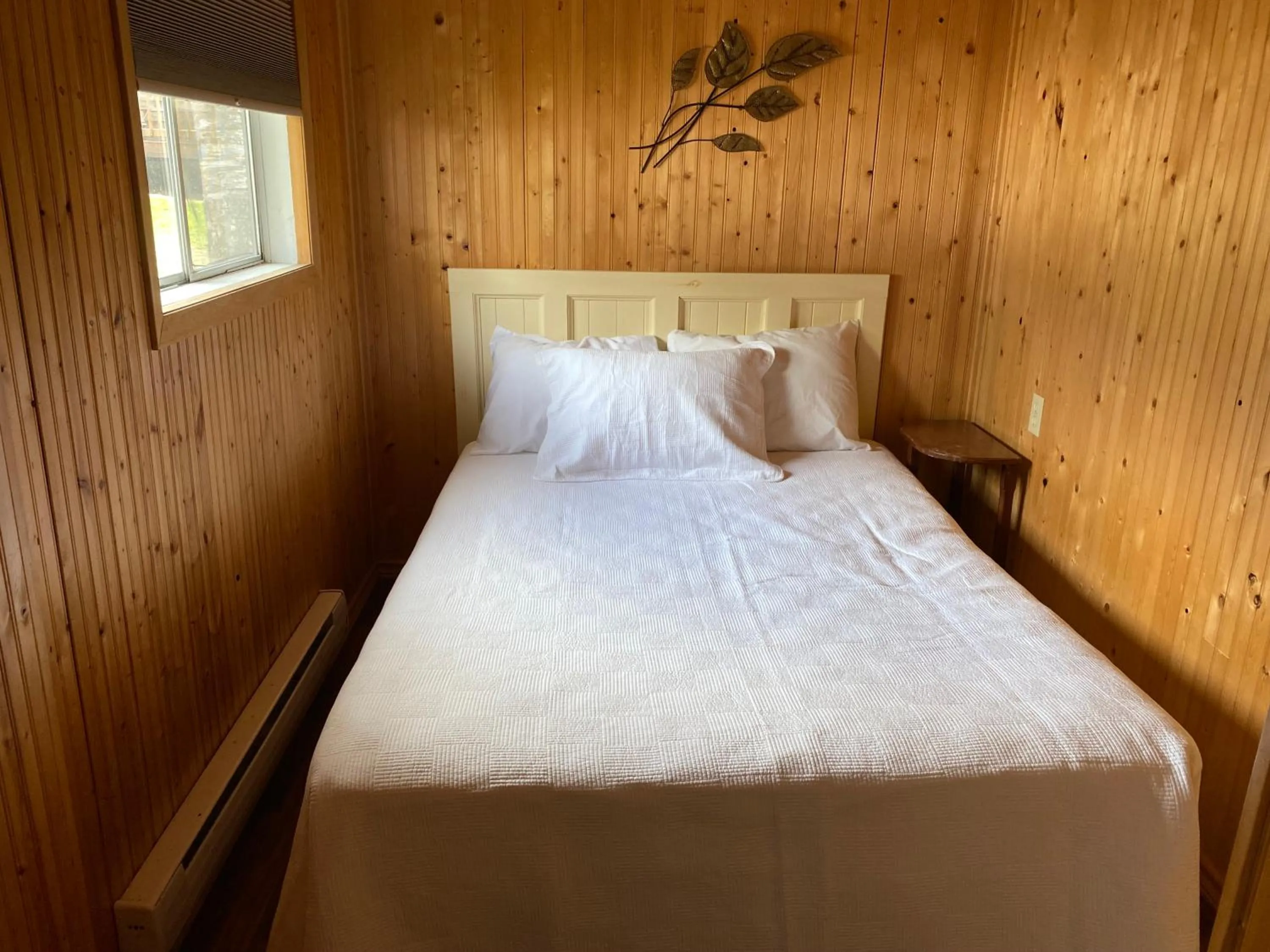 Bed in Merland Park Cottages and Motel
