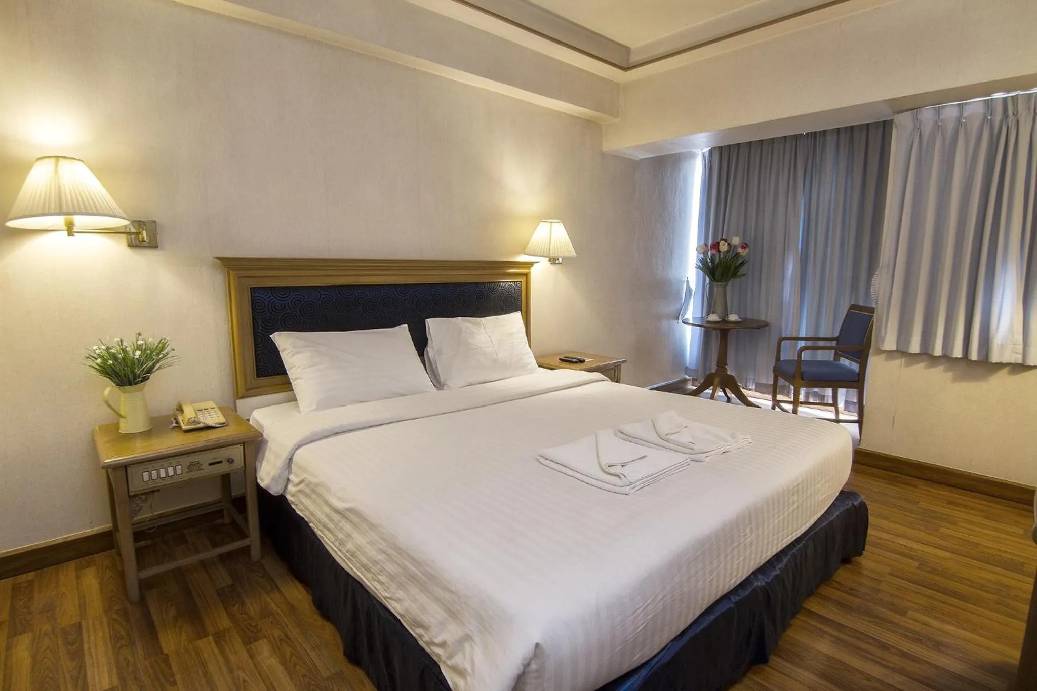 Bed in Bossotel Chiang Mai