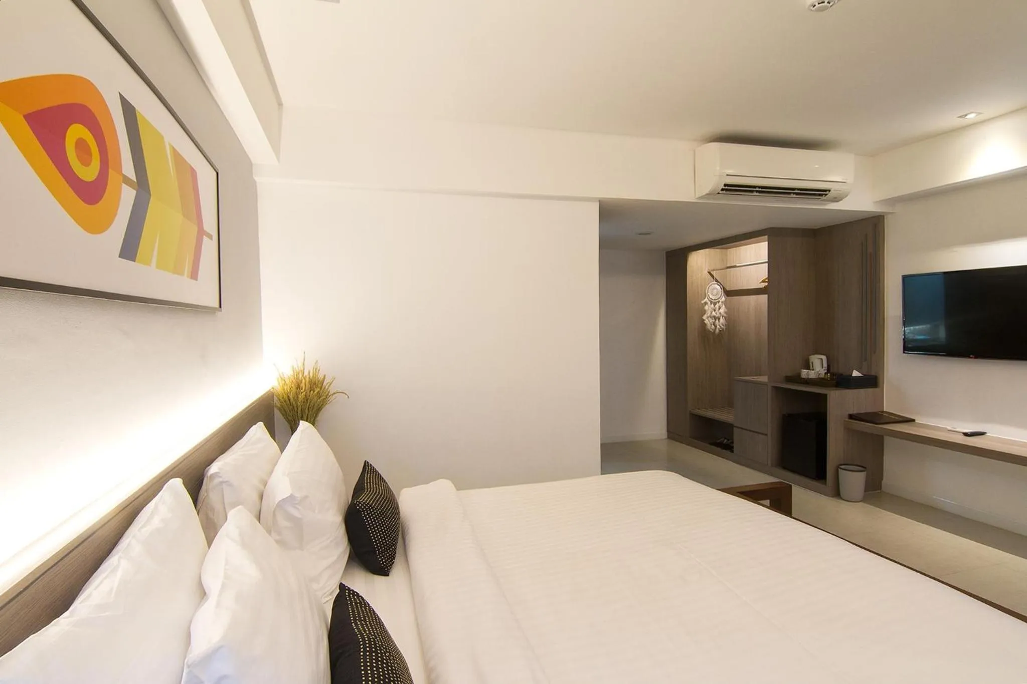 Bed in Bossotel Chiang Mai